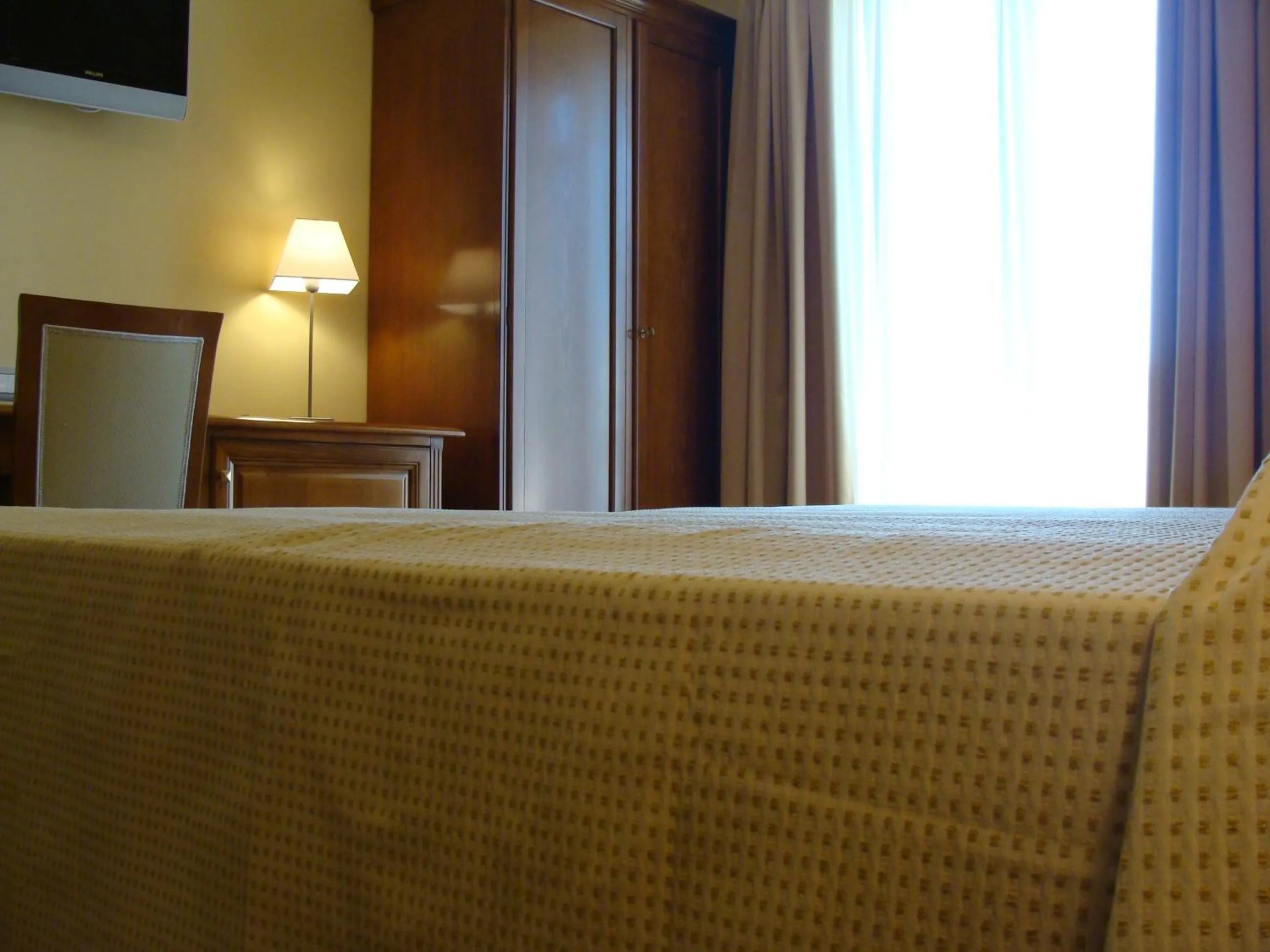 Bed in HOTEL L' ANFORA