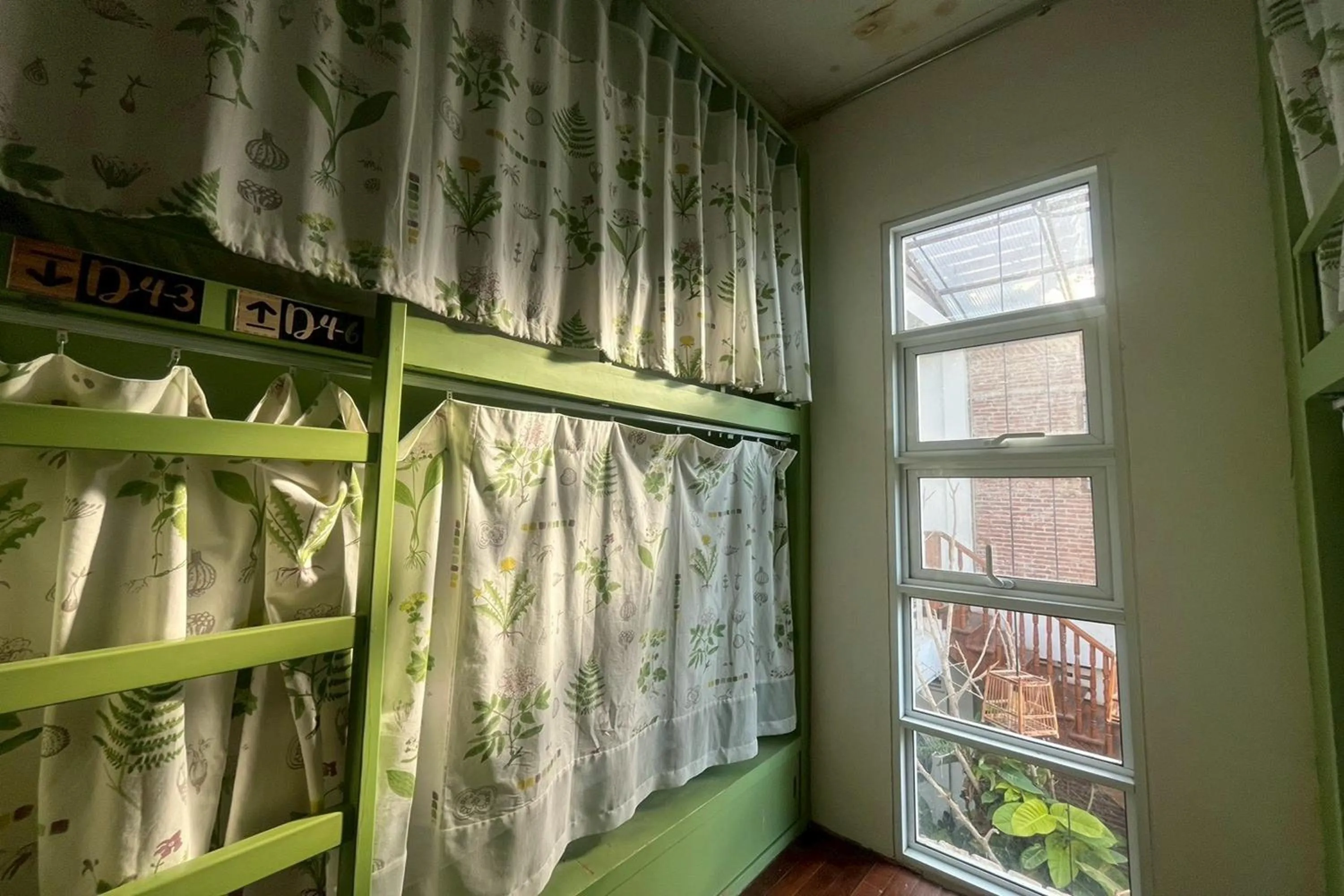 Photo of the whole room, Bed in Memmoth Cafe & Hostel in Lampang