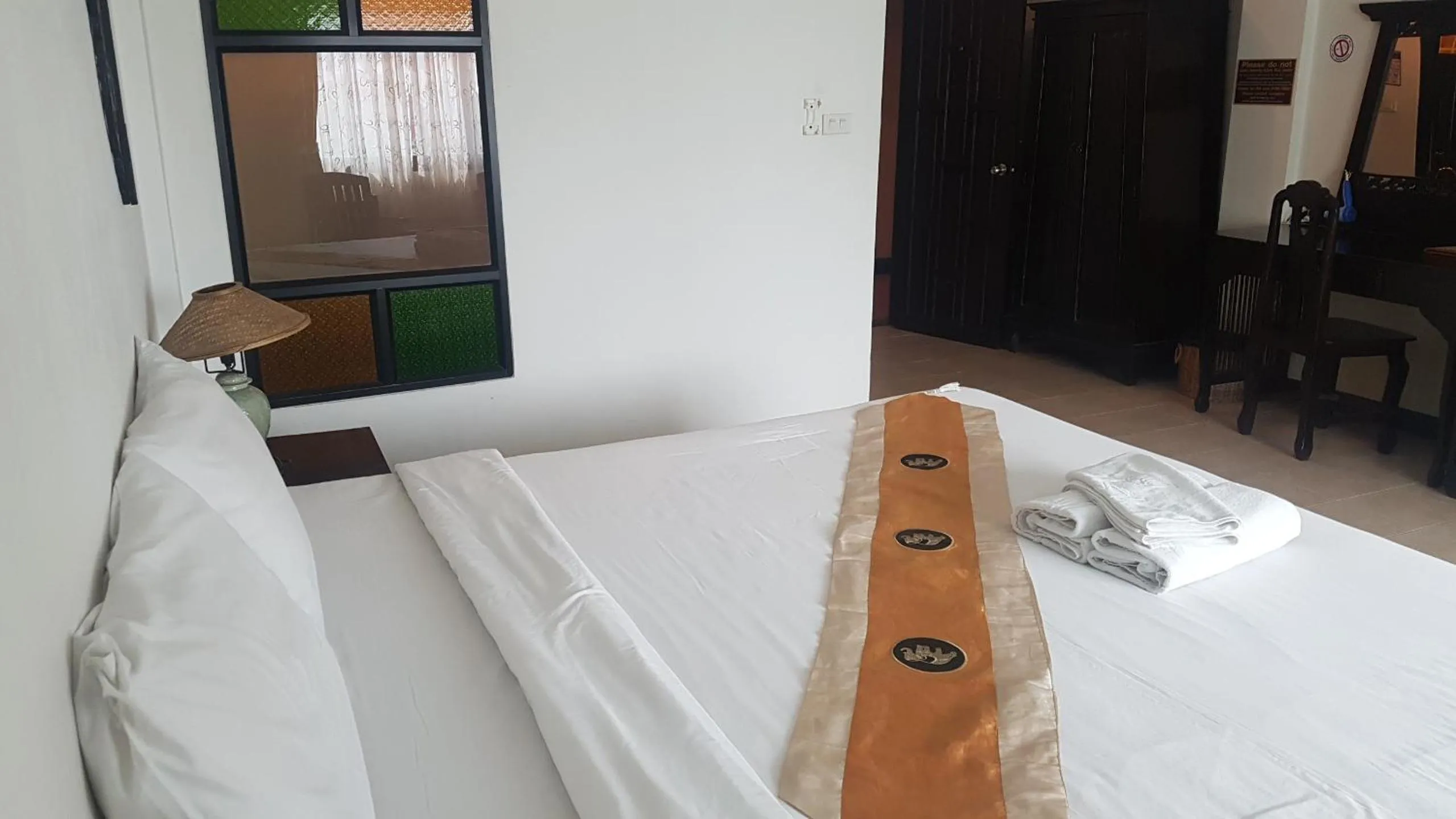 Bed in Wangburapa Grand Hotel