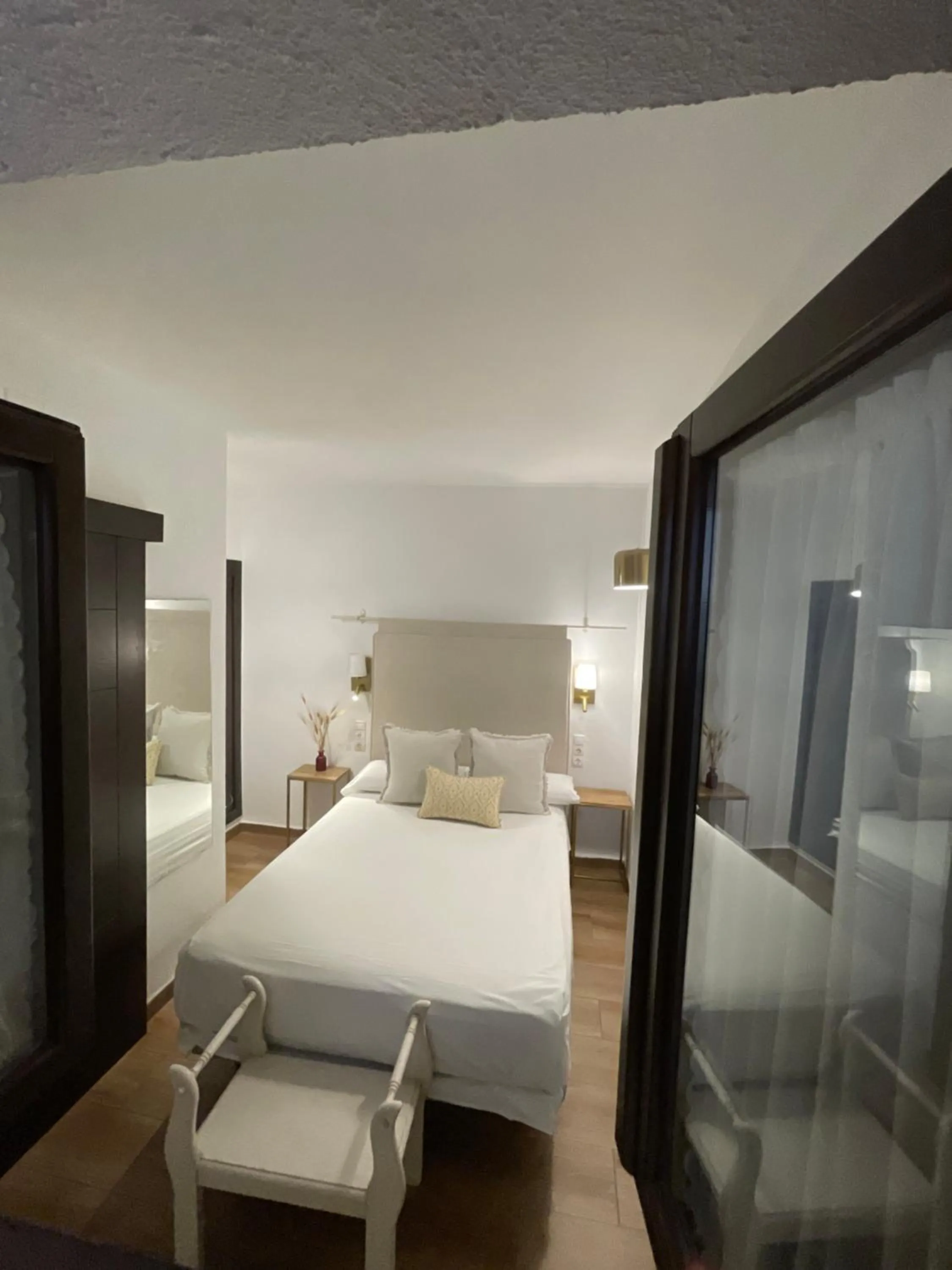 Bed in HOTEL BOUTIQUE ALMA ANDALUSí