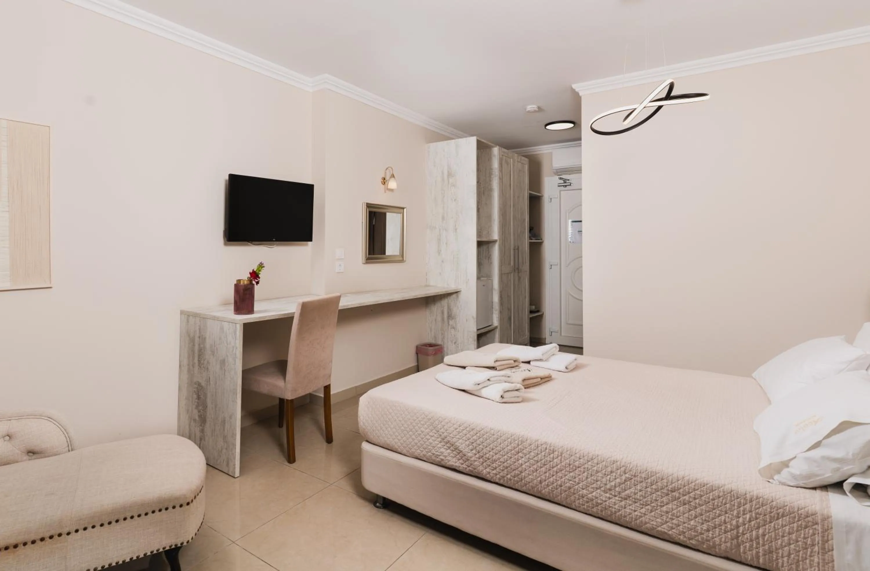 Bed in Aeolos Boutique Hotel & Suites