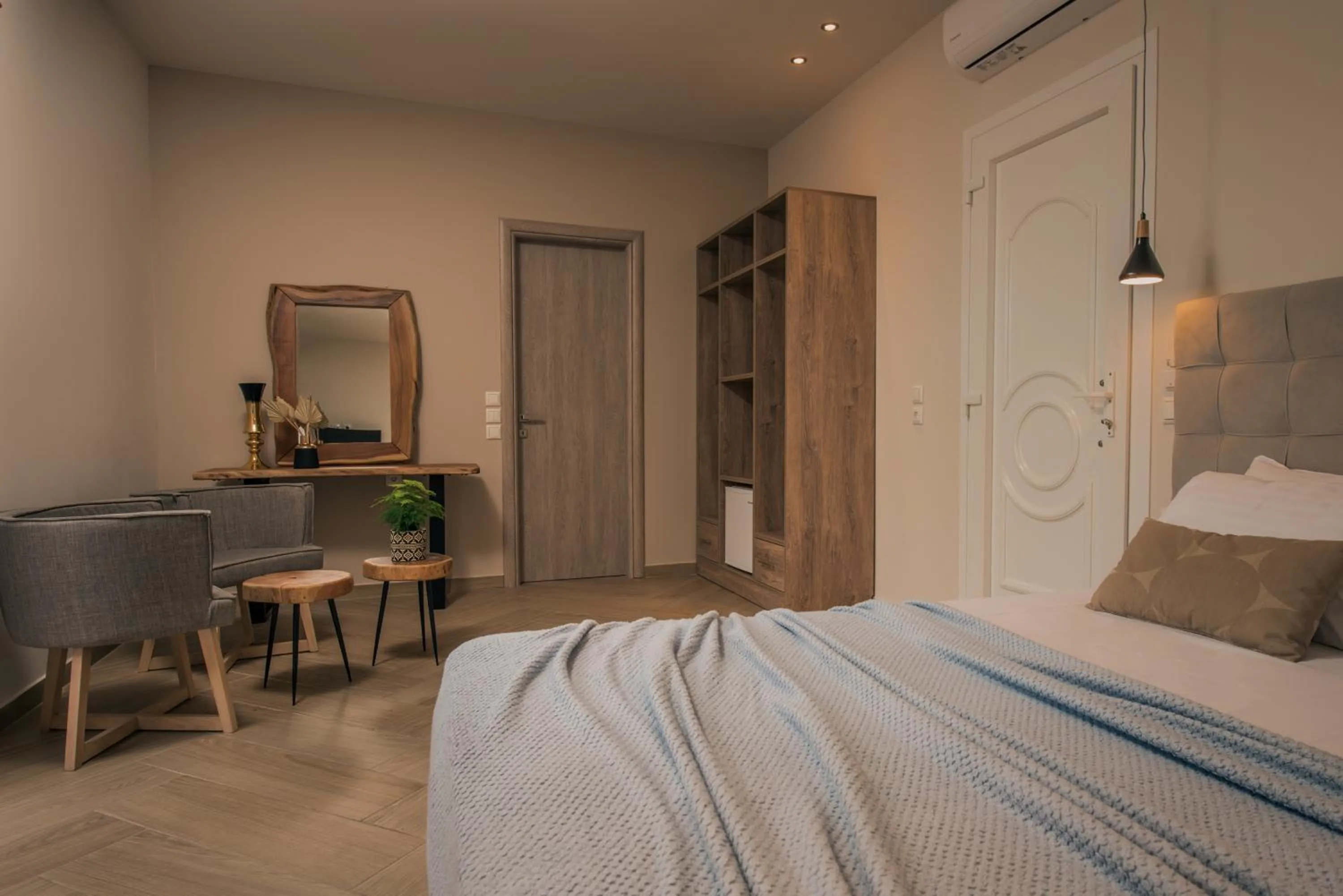 Bed in Aeolos Boutique Hotel & Suites