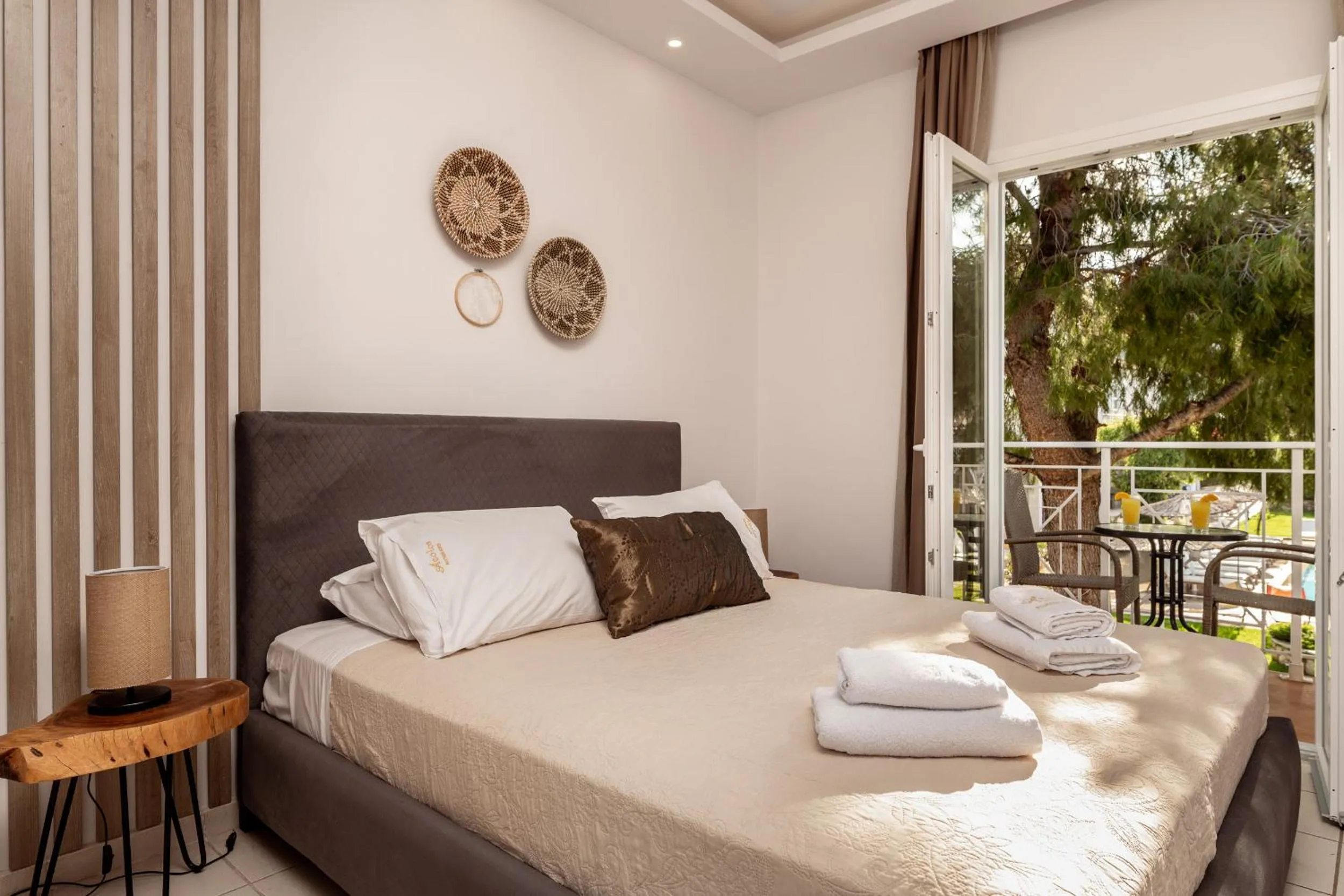 Bed in Aeolos Boutique Hotel & Suites