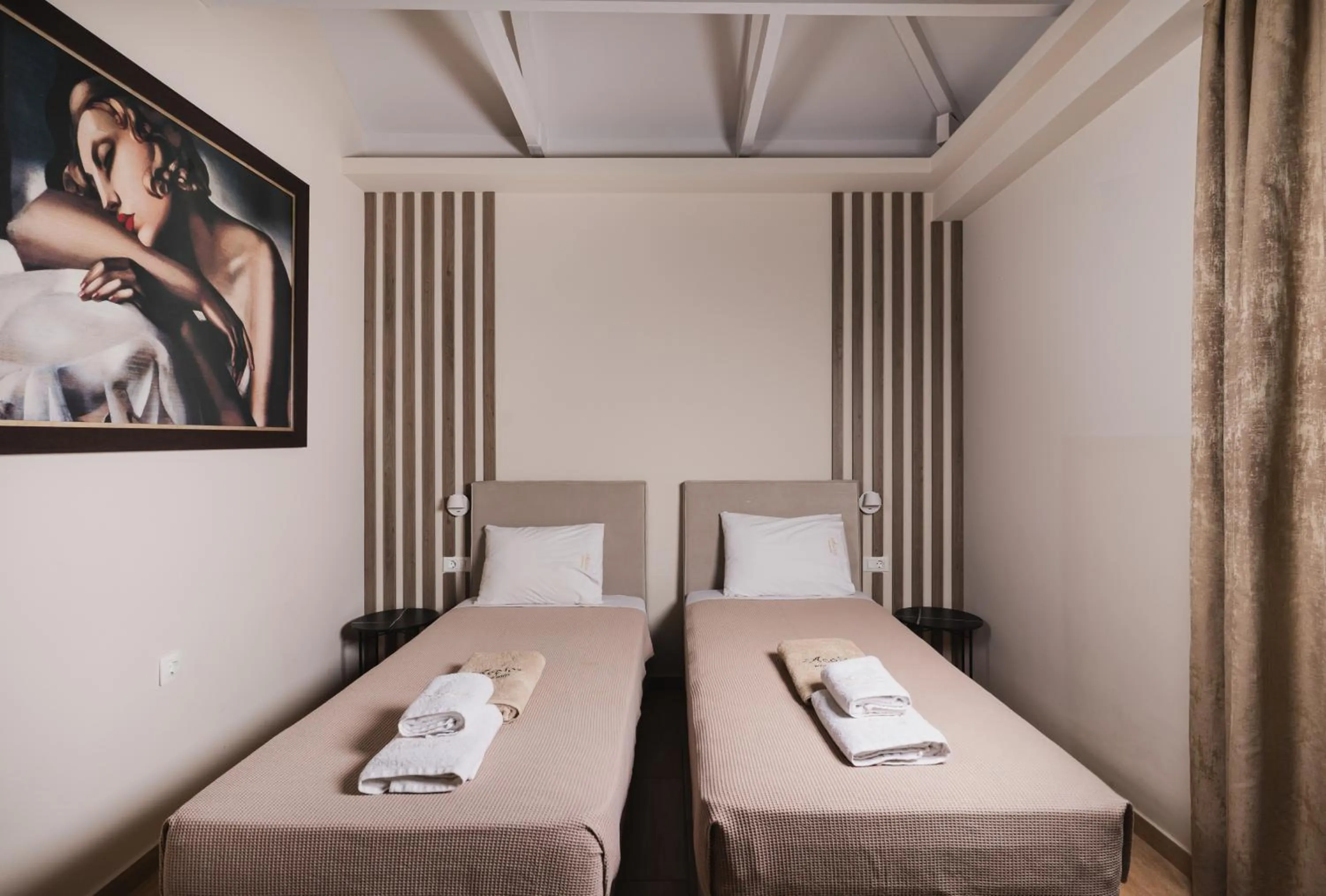 Bed in Aeolos Boutique Hotel & Suites