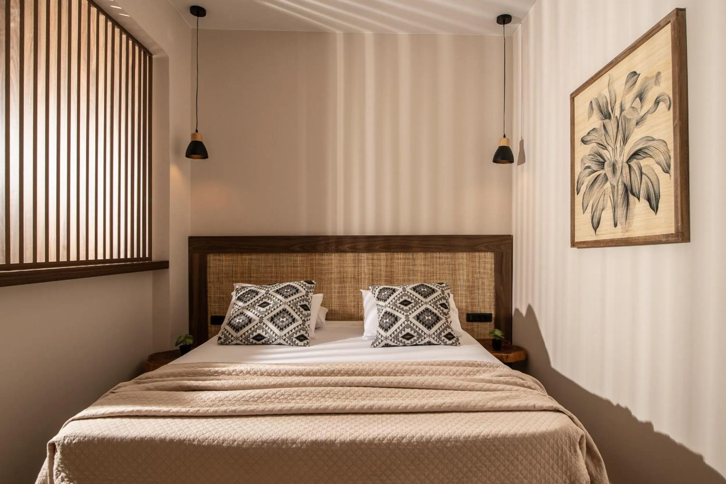 Bed in Aeolos Boutique Hotel & Suites