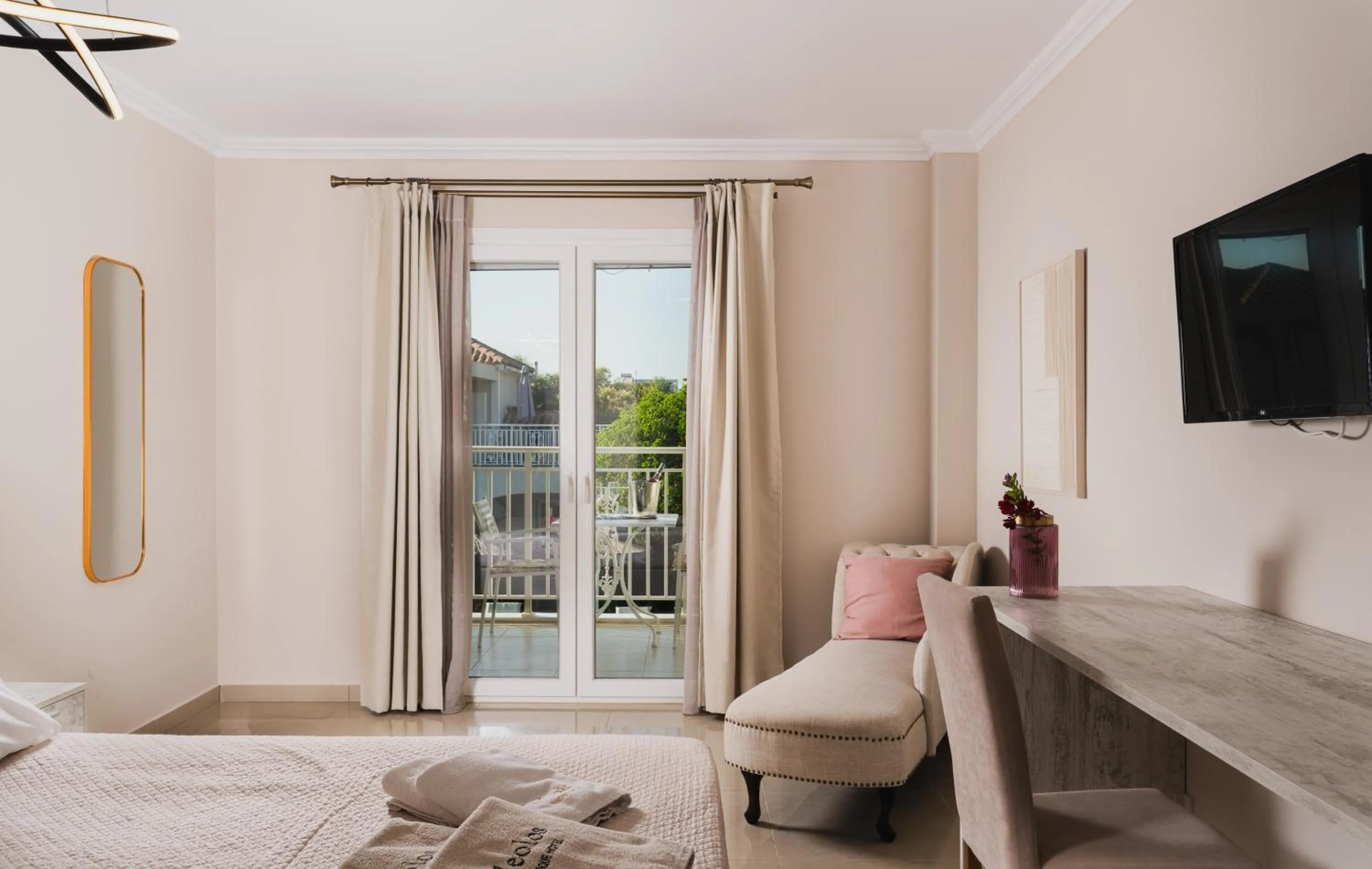 Bed in Aeolos Boutique Hotel & Suites