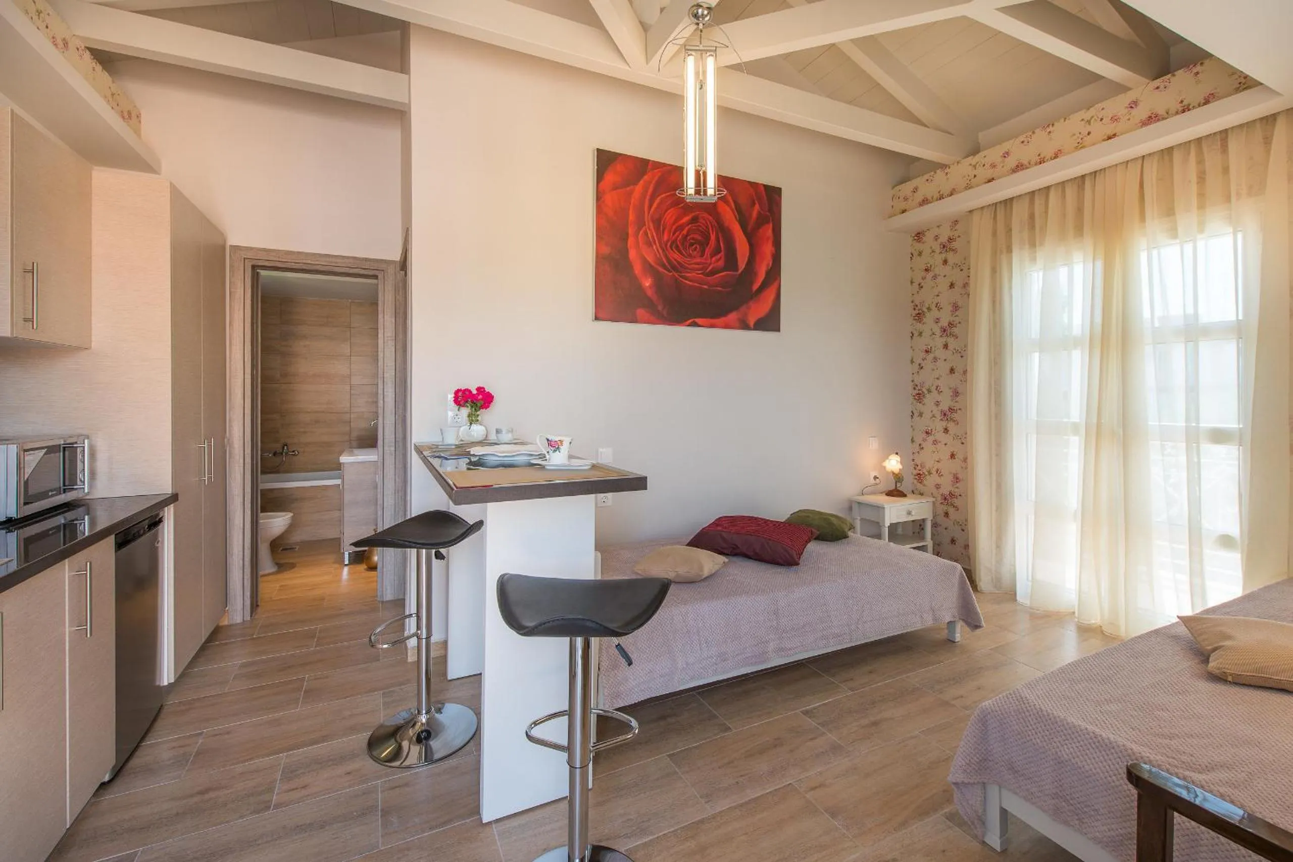 Kitchen or kitchenette, Bed in Aeolos Boutique Hotel & Suites