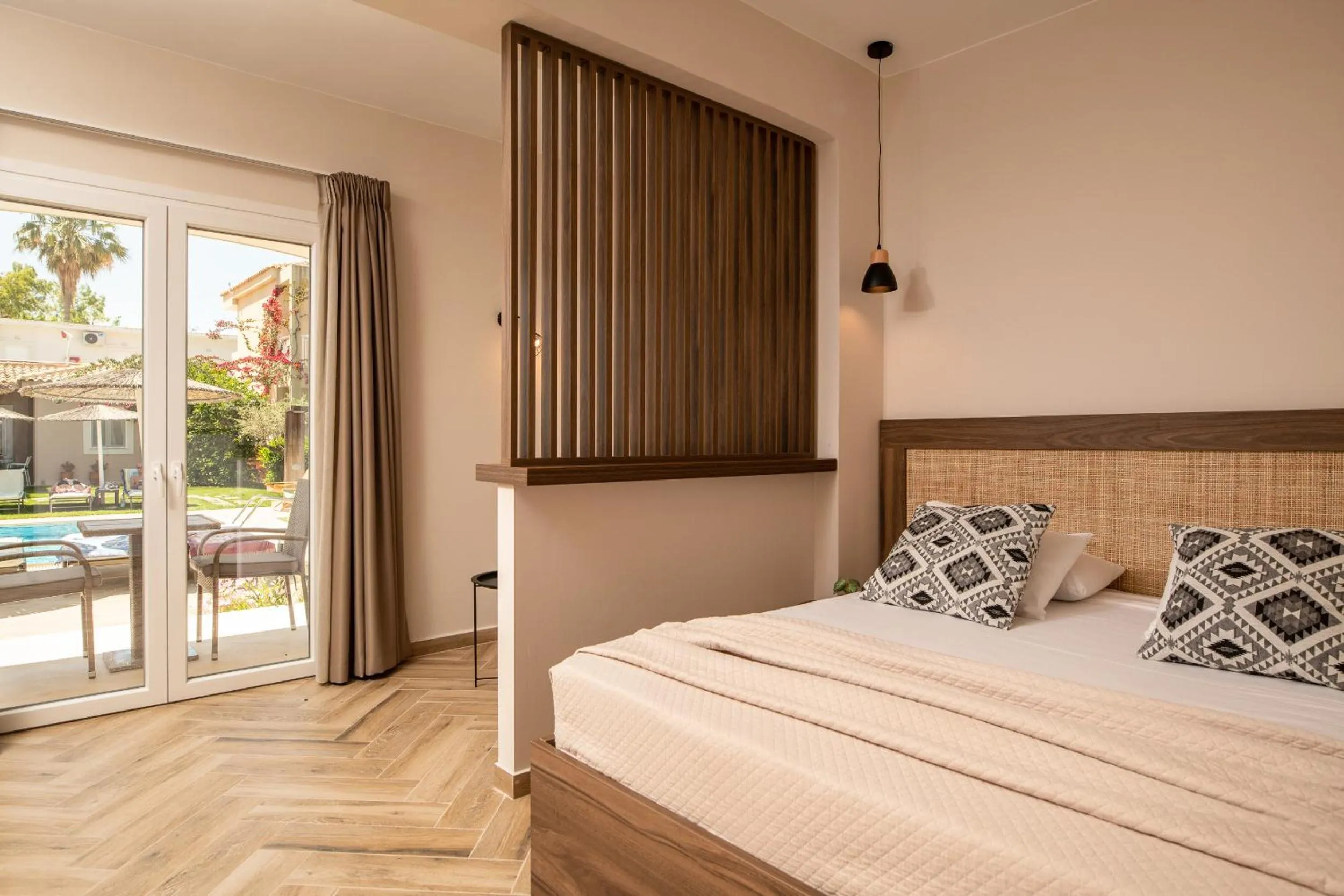 Bed in Aeolos Boutique Hotel & Suites