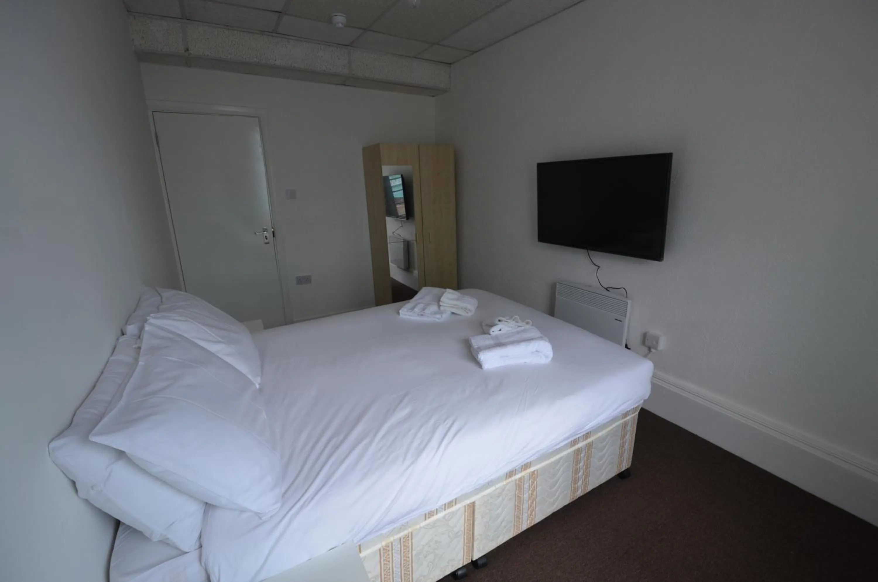 Bed in Central Comfort Rooms