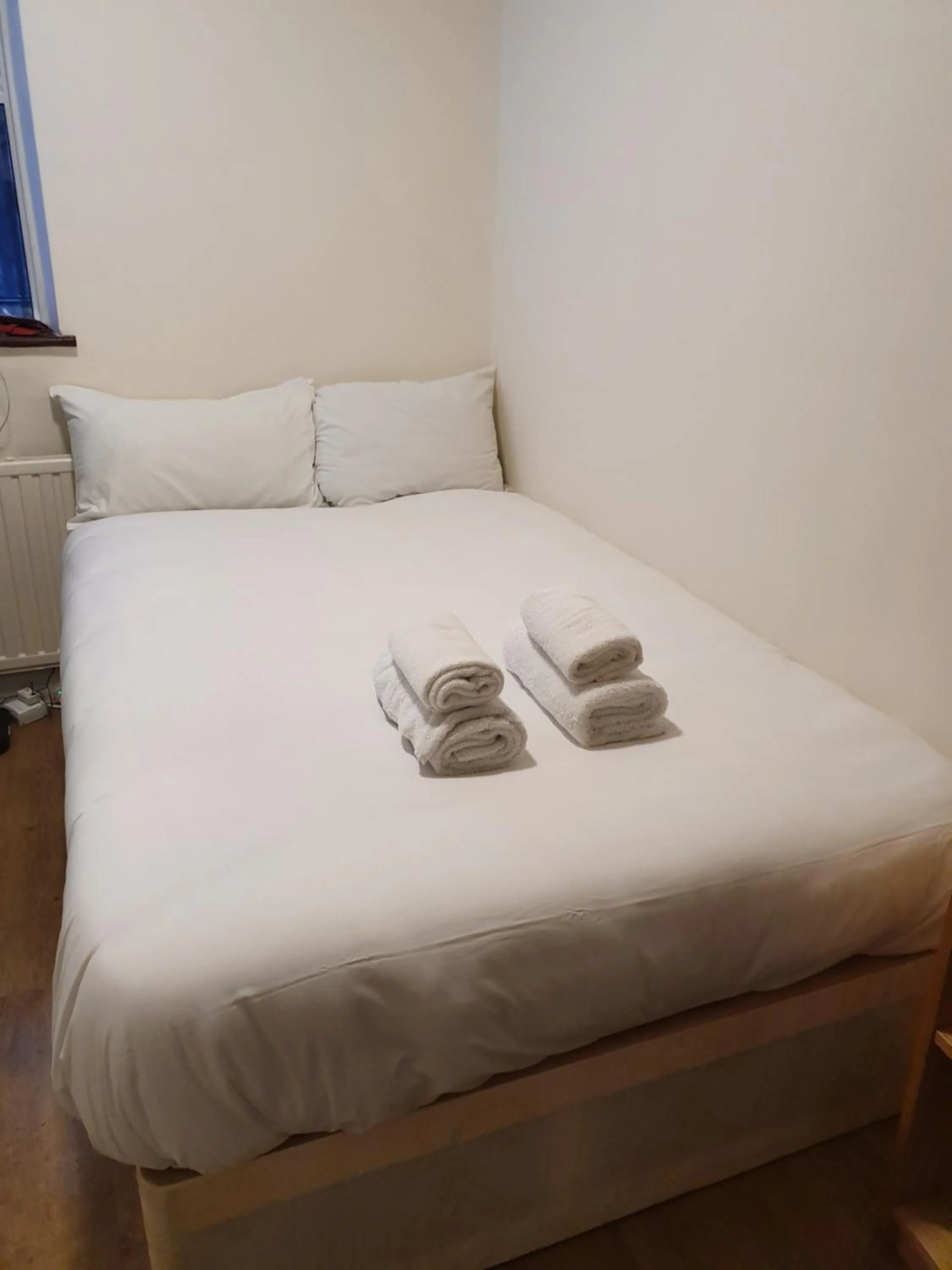 Bed in Central Comfort Rooms