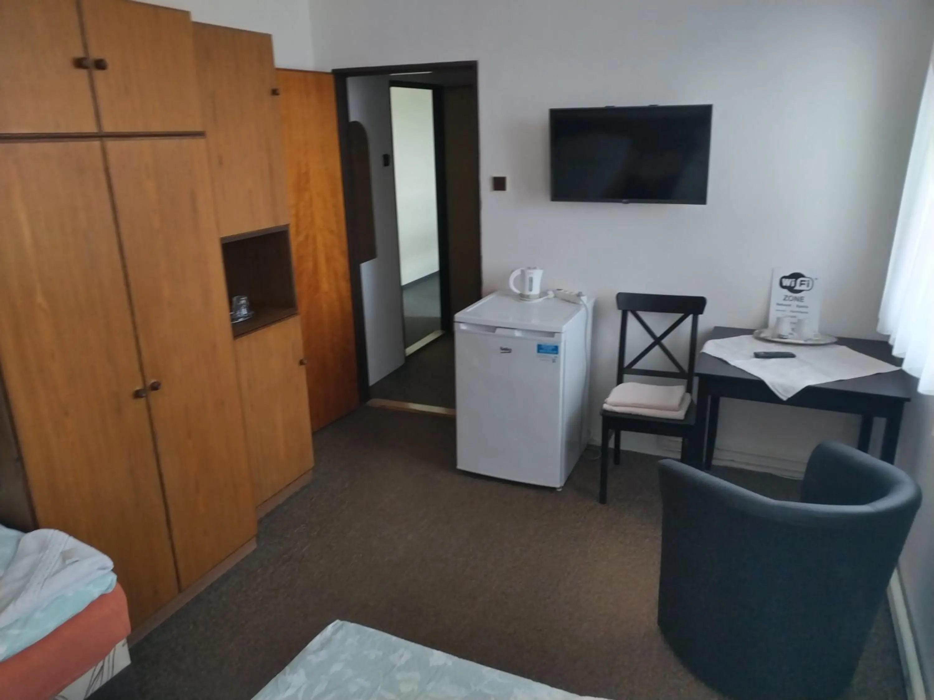 Seating area, Bed in Pension Sparta