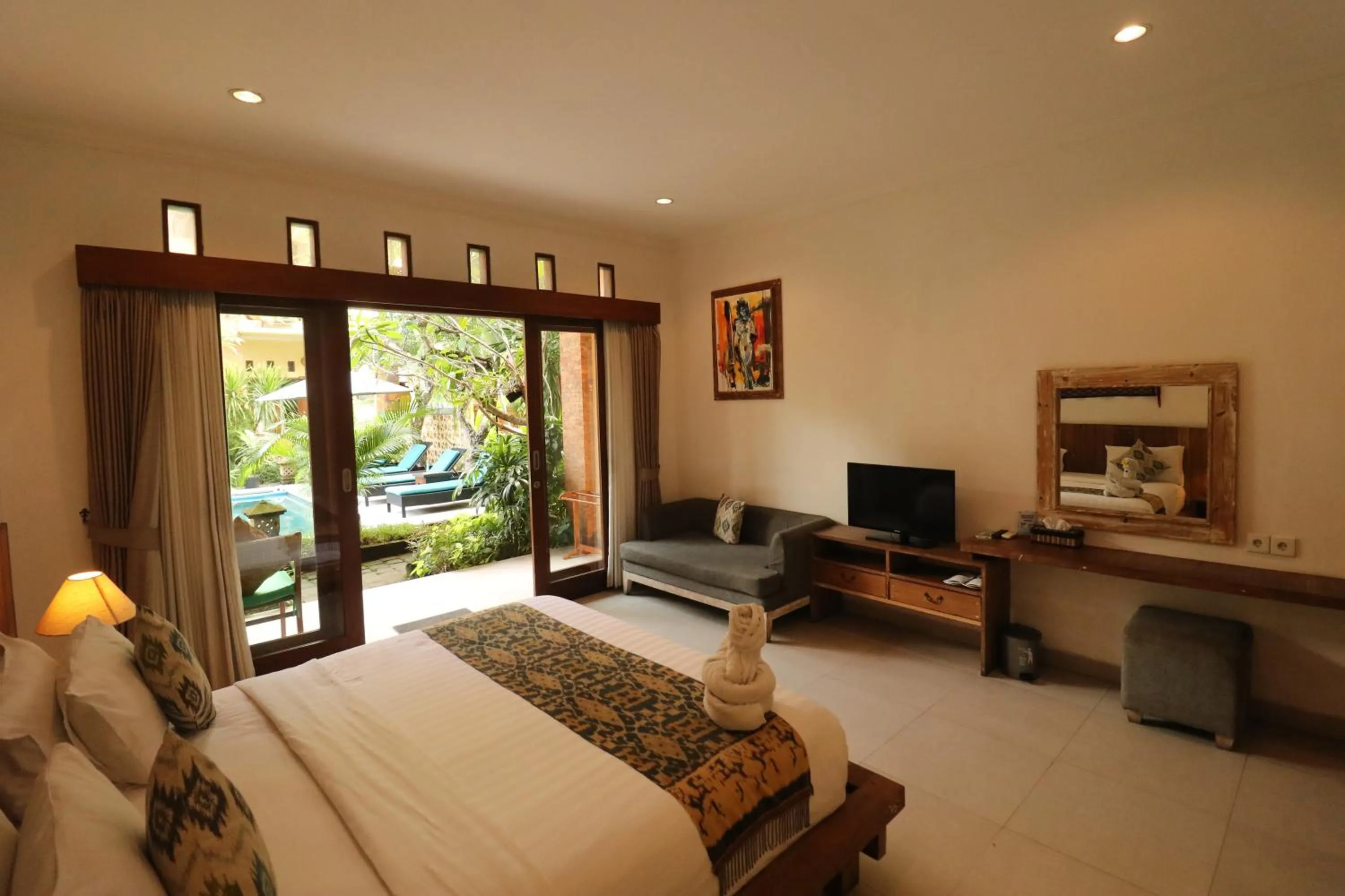 Text overlay, Bed in Mina Pelasa Hotel