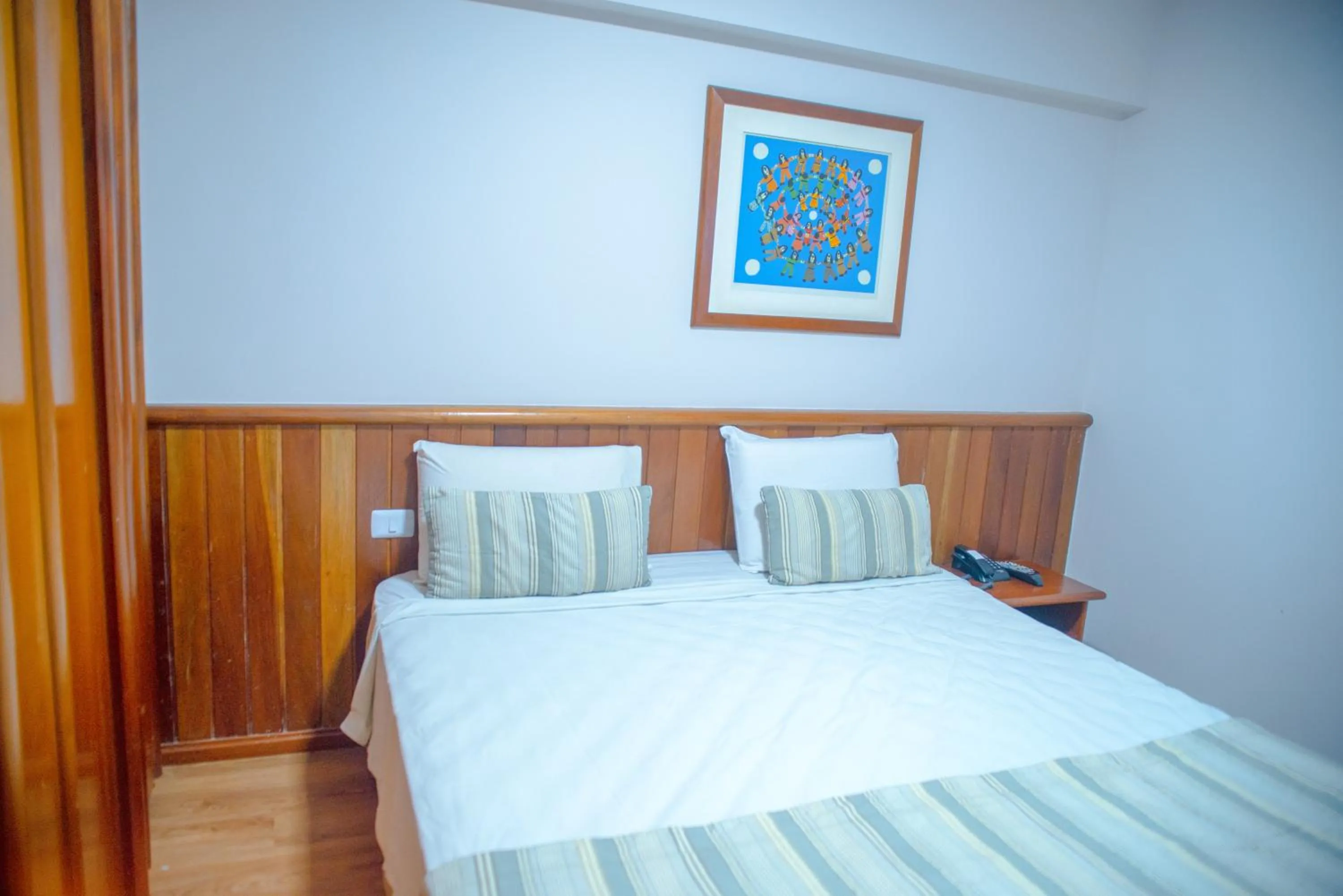 Bed in SAN MARINO SUITES HOTEL By NOBILE