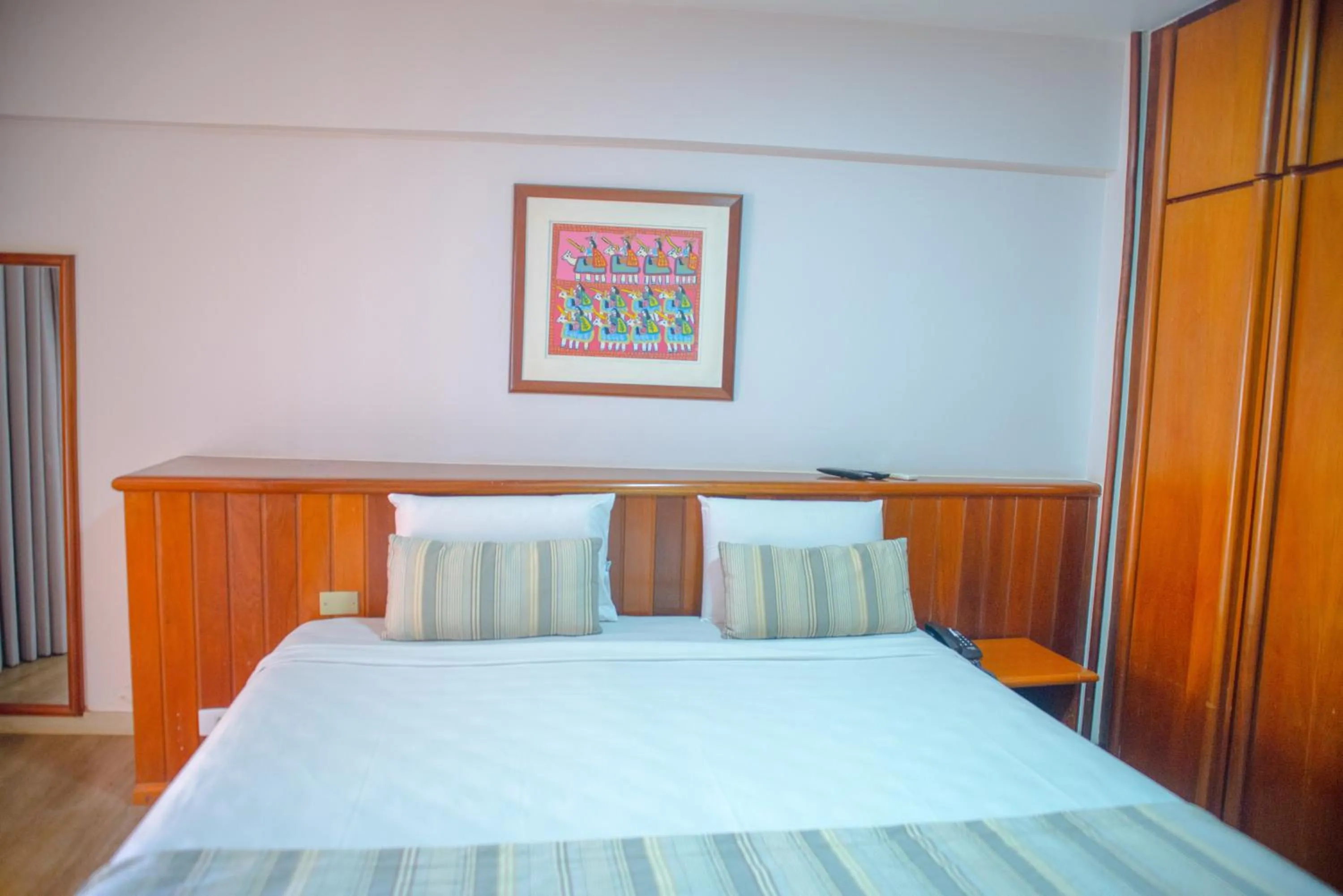 Bed in SAN MARINO SUITES HOTEL By NOBILE