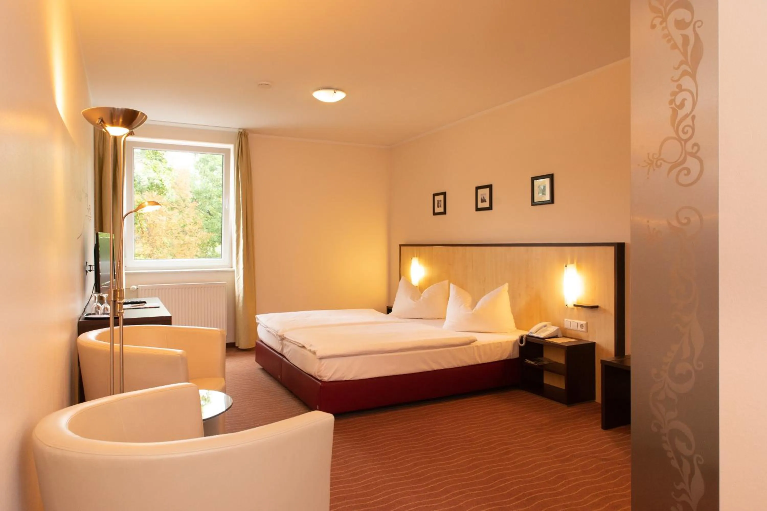 Photo of the whole room, Bed in Bergwirtschaft Wilder Mann Hotel und Restaurant