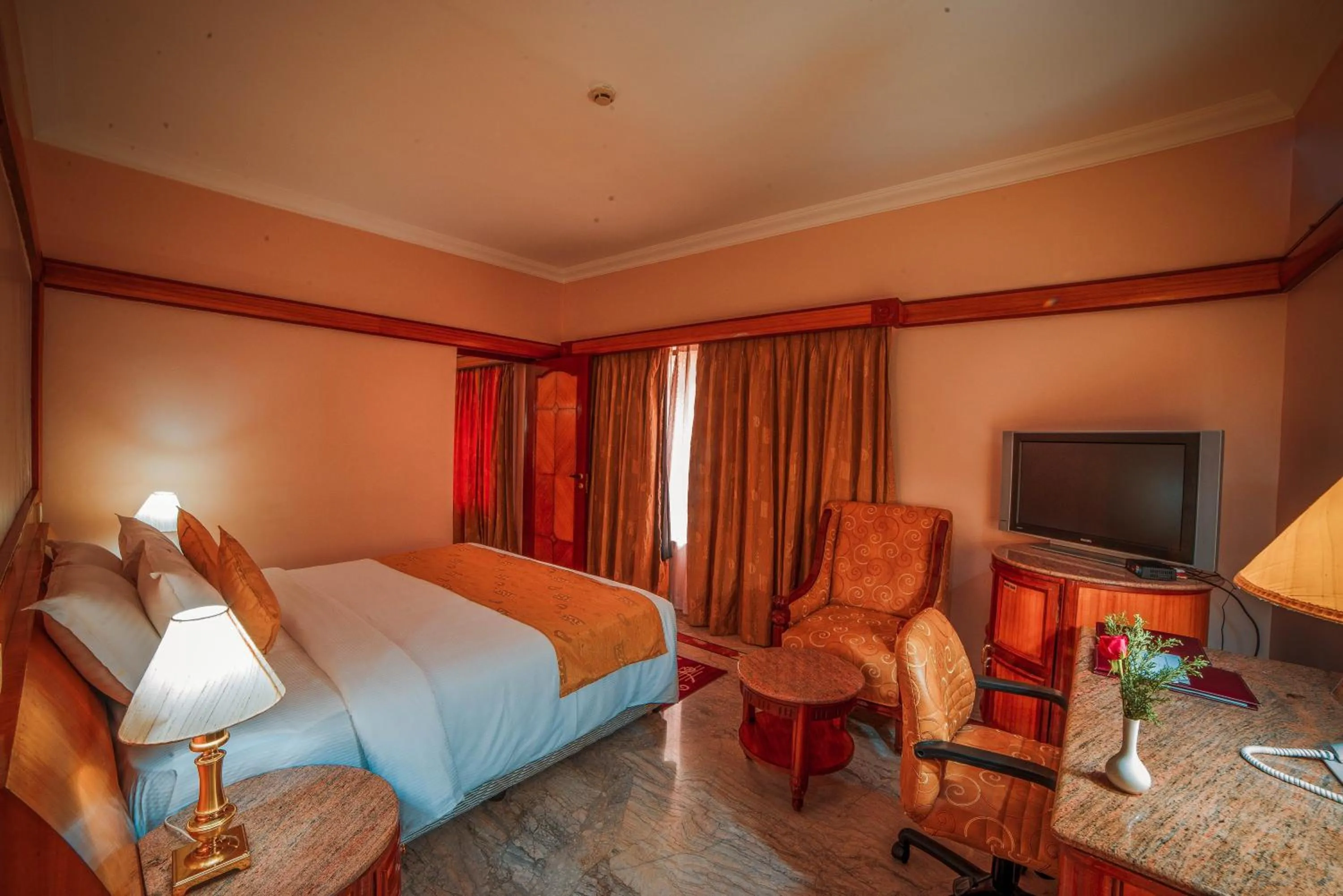 Photo of the whole room, Bed in Raj Park Hotel Chennai