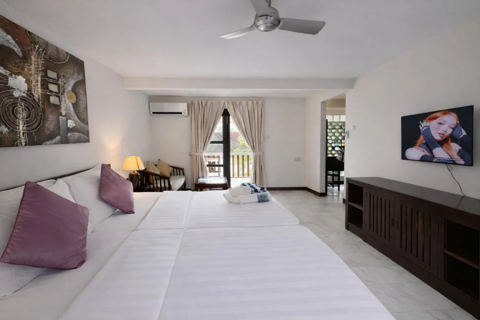 Bed in Frangipani Langkawi Resort