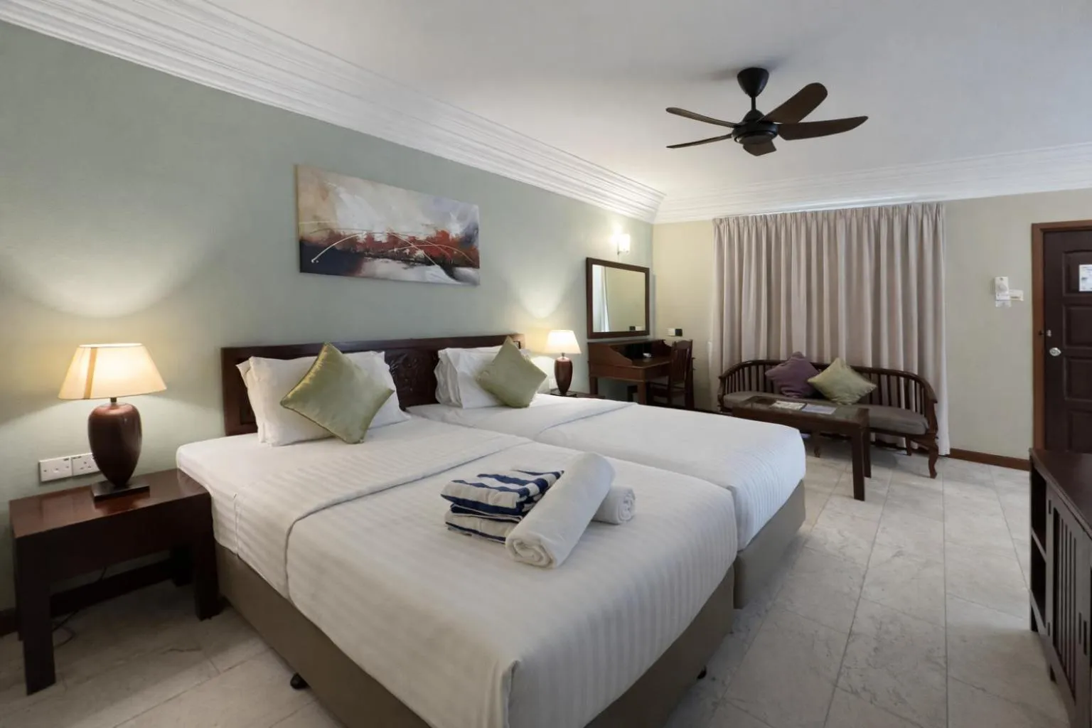 Bed in Frangipani Langkawi Resort