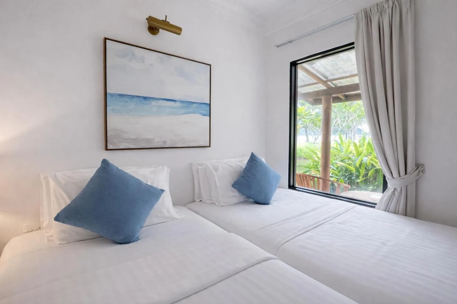 Bed in Frangipani Langkawi Resort