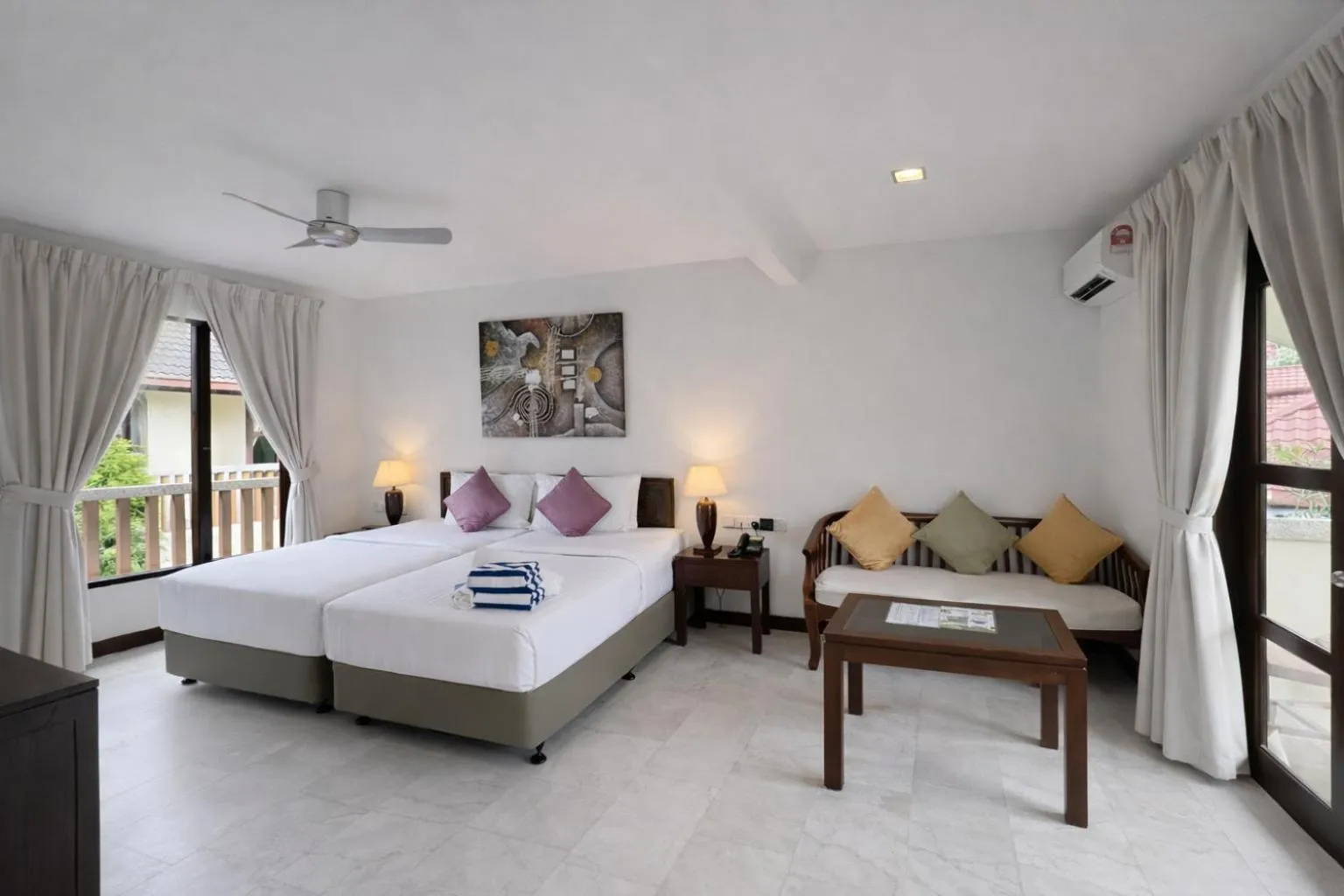 Bed in Frangipani Langkawi Resort