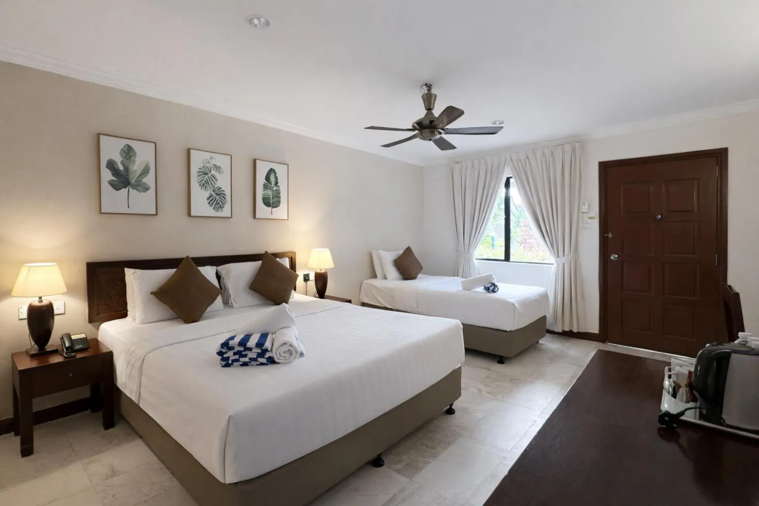 Bed in Frangipani Langkawi Resort