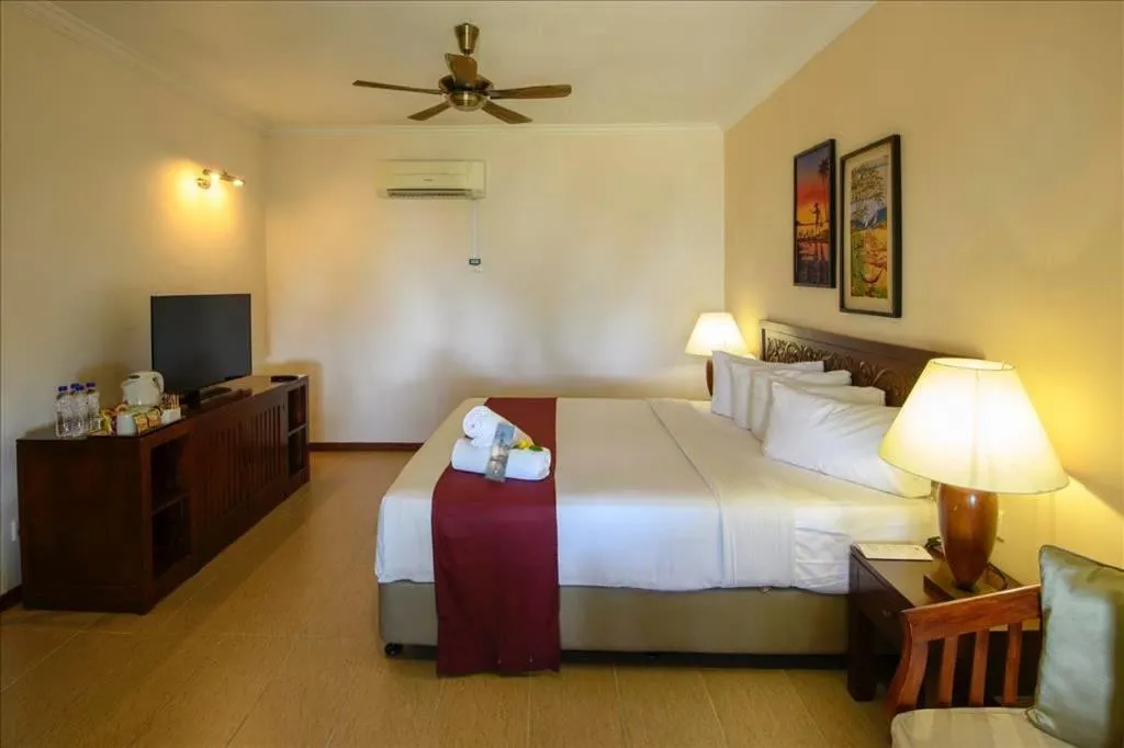 Bed in Frangipani Langkawi Resort