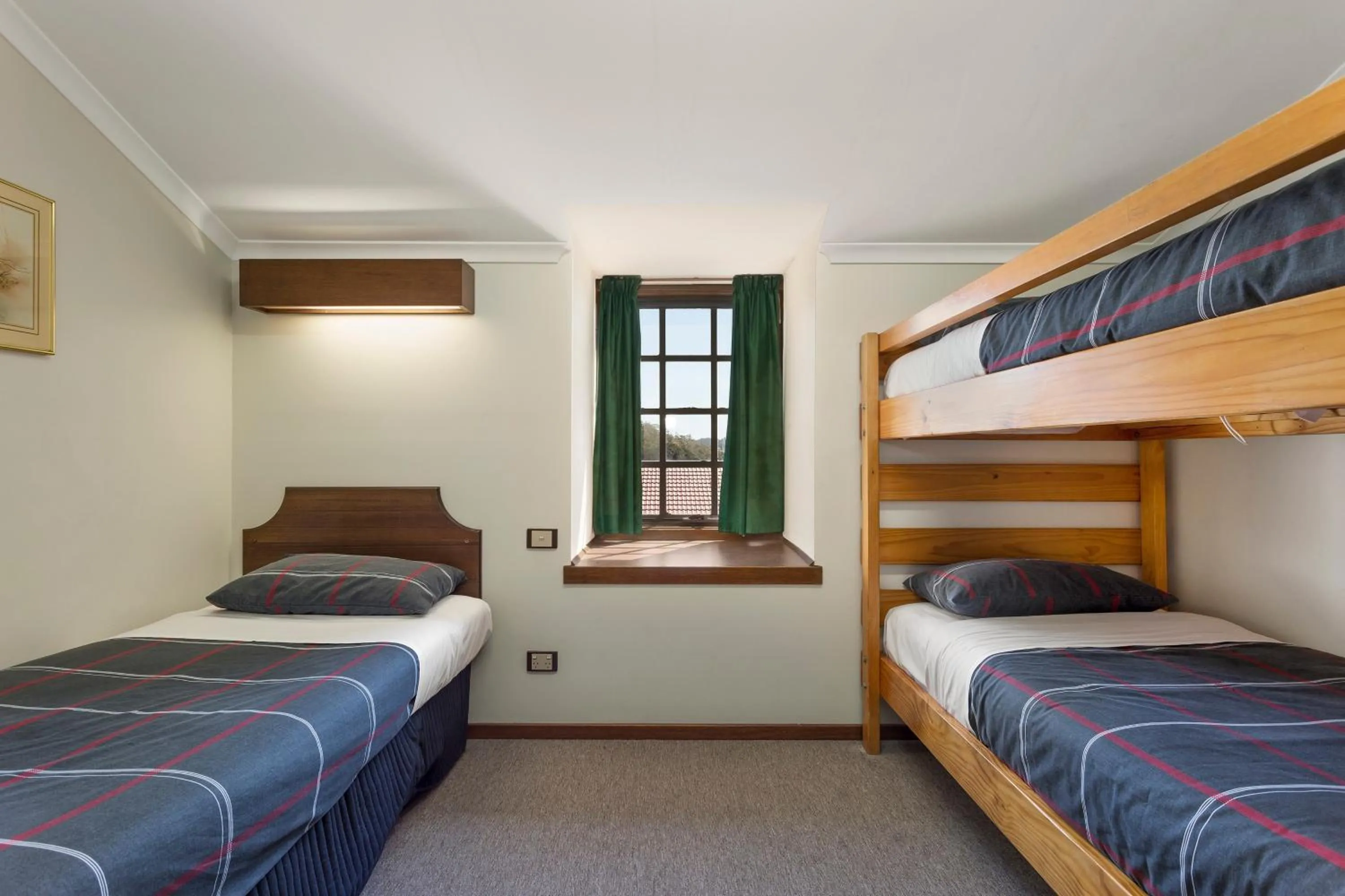 Bed in Village Family Motor Inn