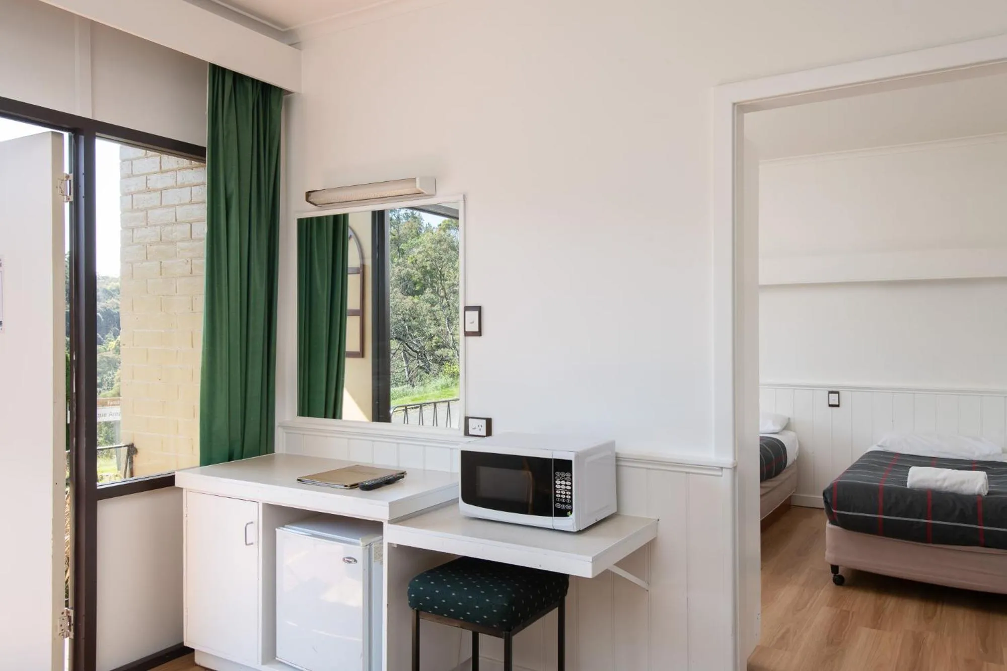 Bed in Village Family Motor Inn