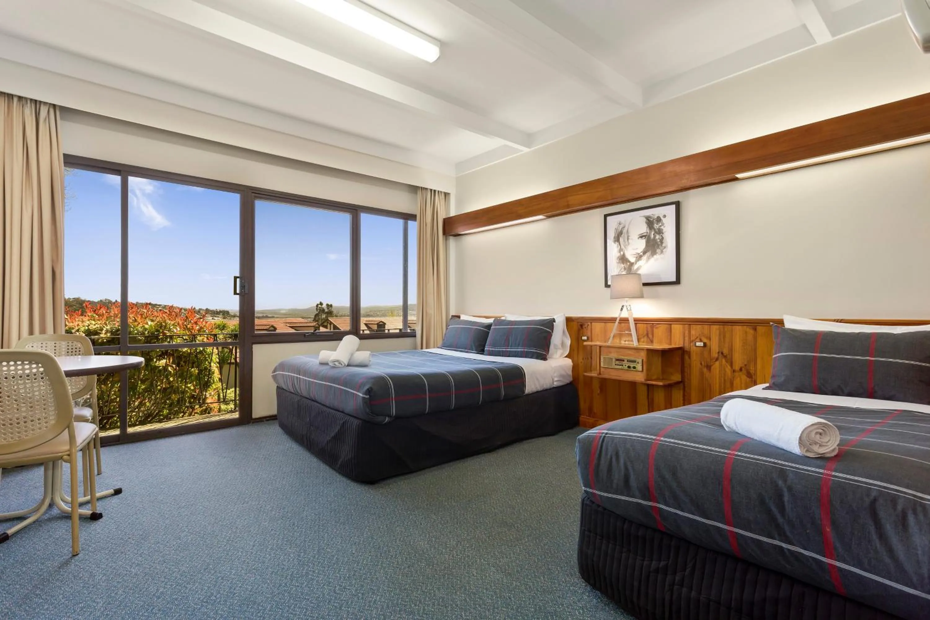 Bed in Village Family Motor Inn