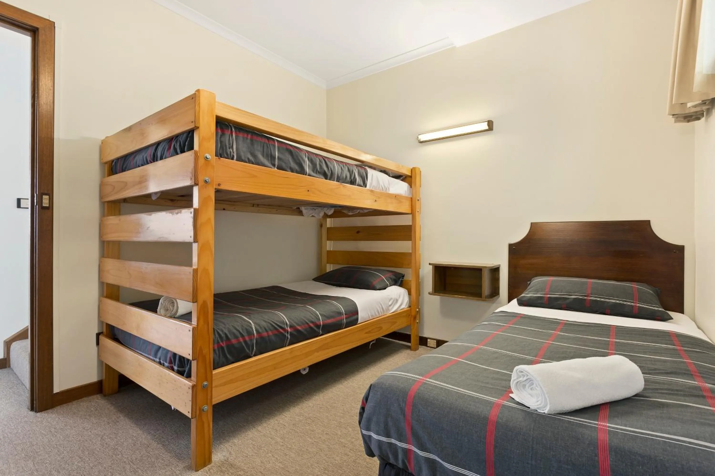 Bed in Village Family Motor Inn