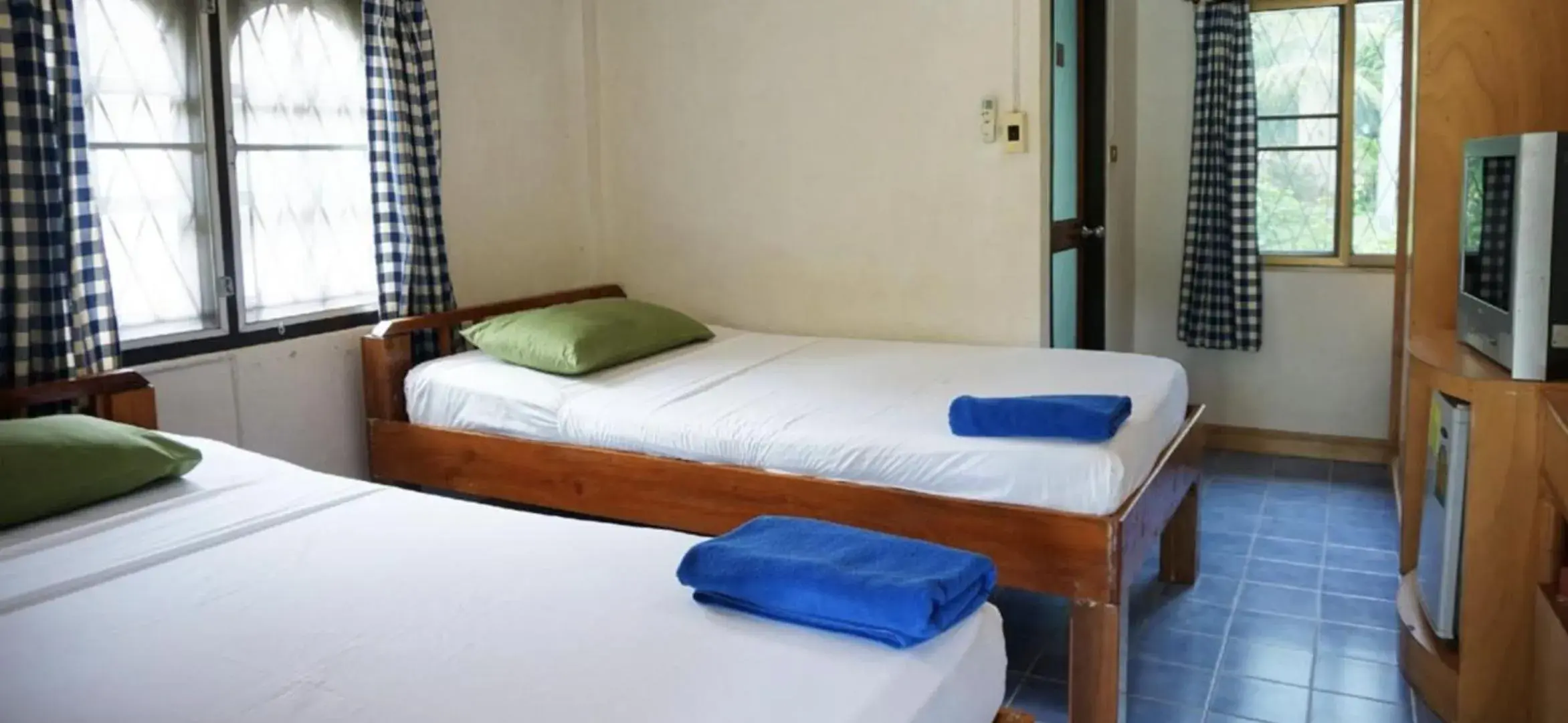 Bed in First Villa Beach Resort Bed in First Villa Beach Resort