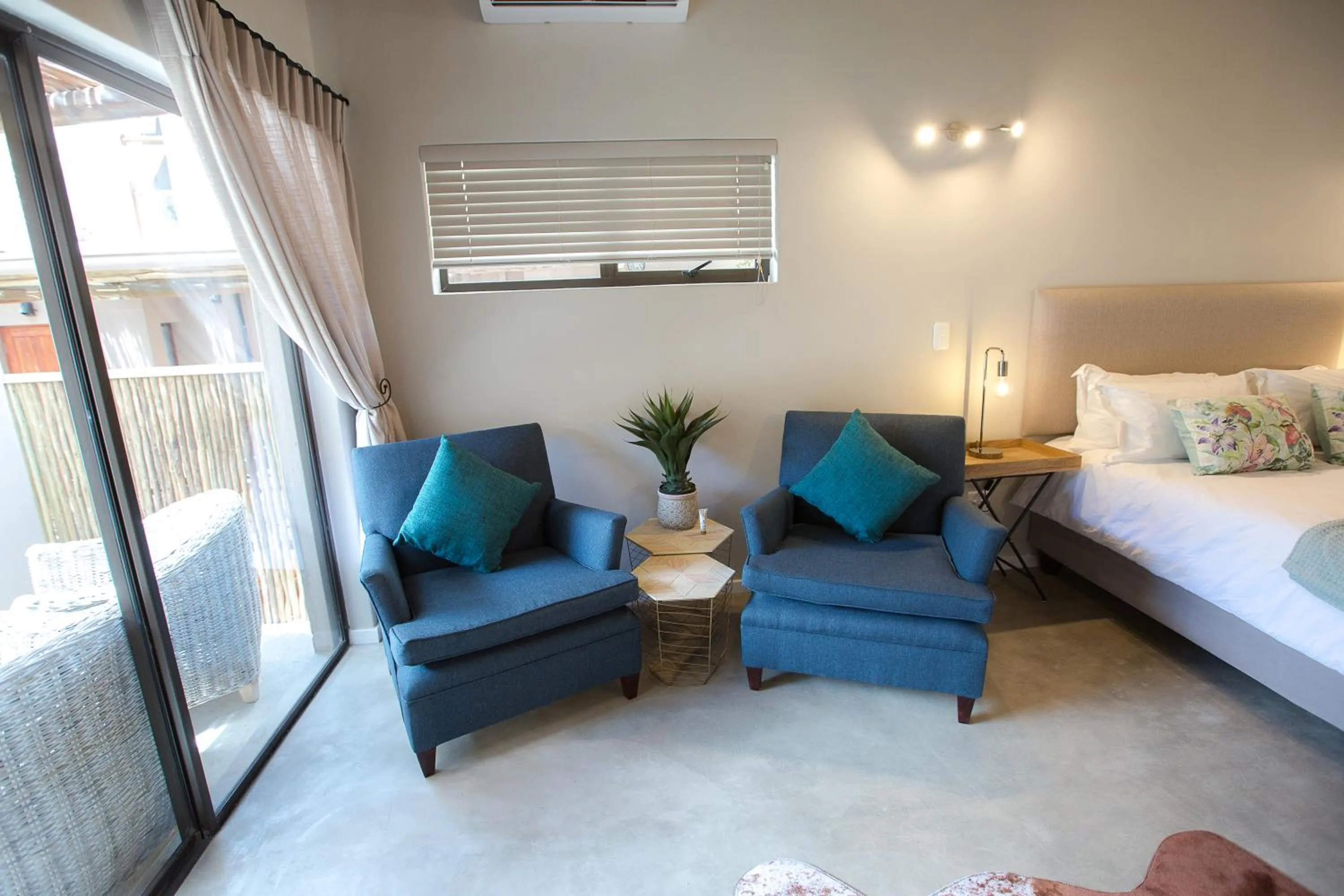 Seating area, Bed in Maya Manor