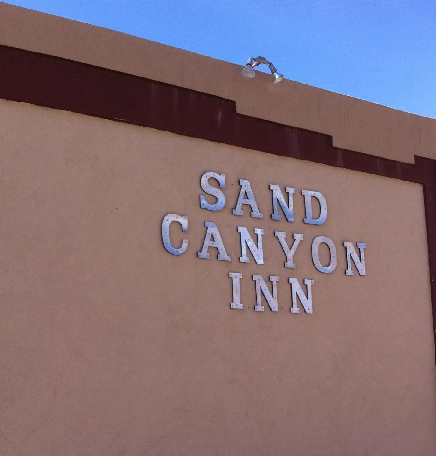 Property logo or sign in National 9 Inn Sand Canyon