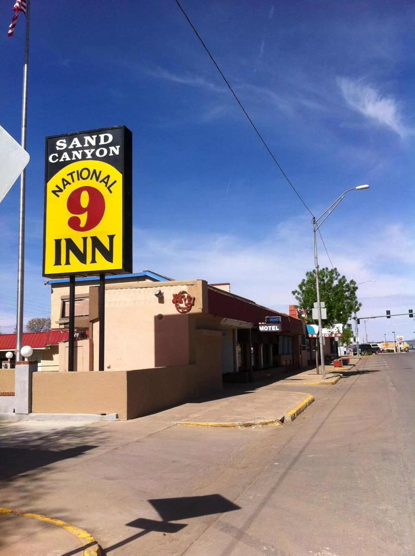 Property logo or sign in National 9 Inn Sand Canyon