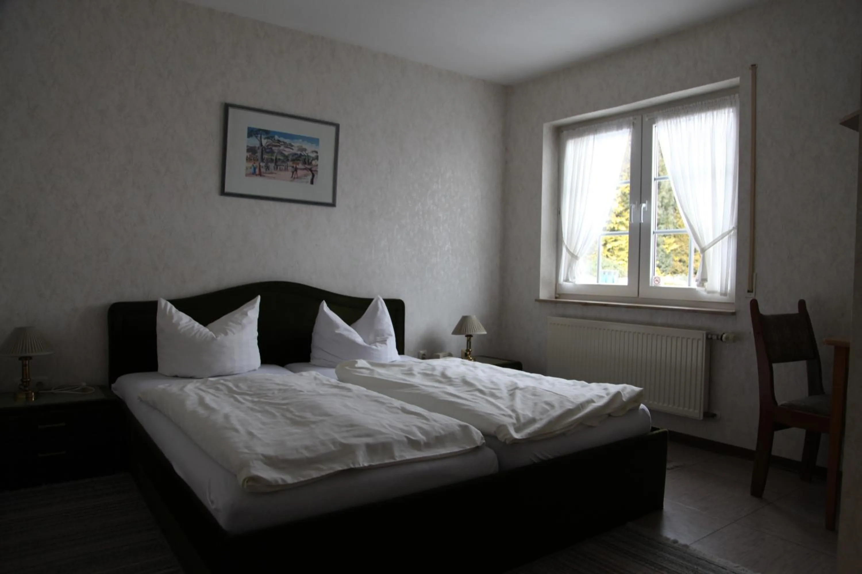 Bed in Hotel Landhaus Köln