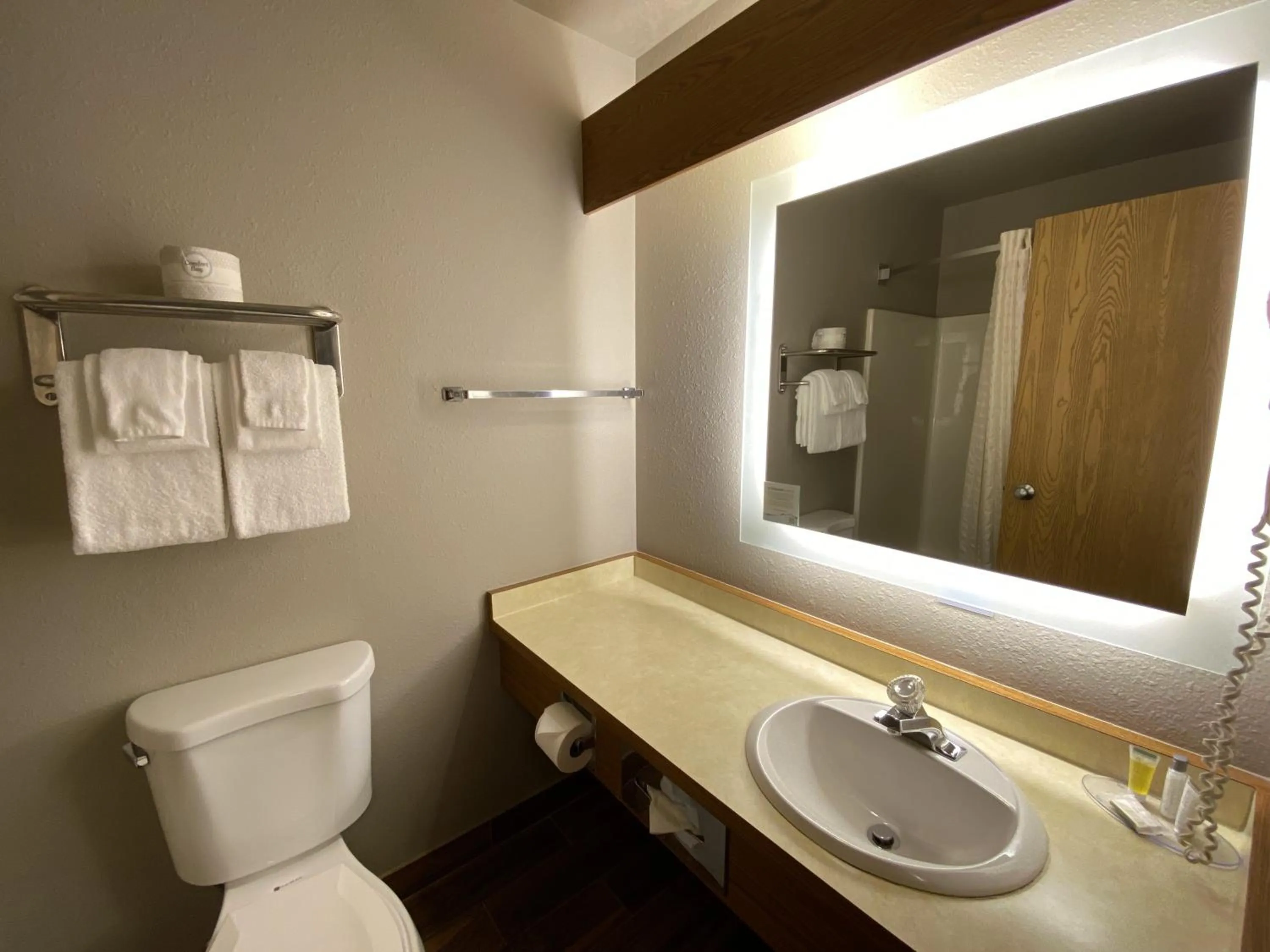 Toilet in Super 8 by Wyndham Green Bay Near Stadium