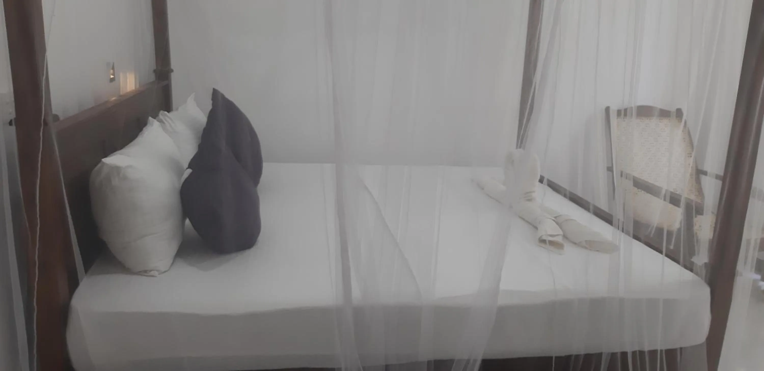 Bed in Butterfly Homestead Hotel