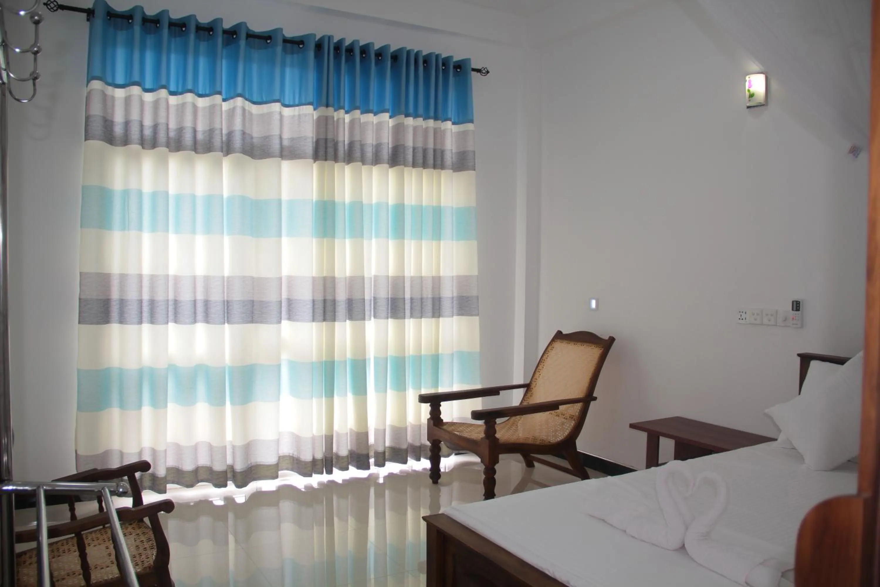 Bed in Butterfly Homestead Hotel