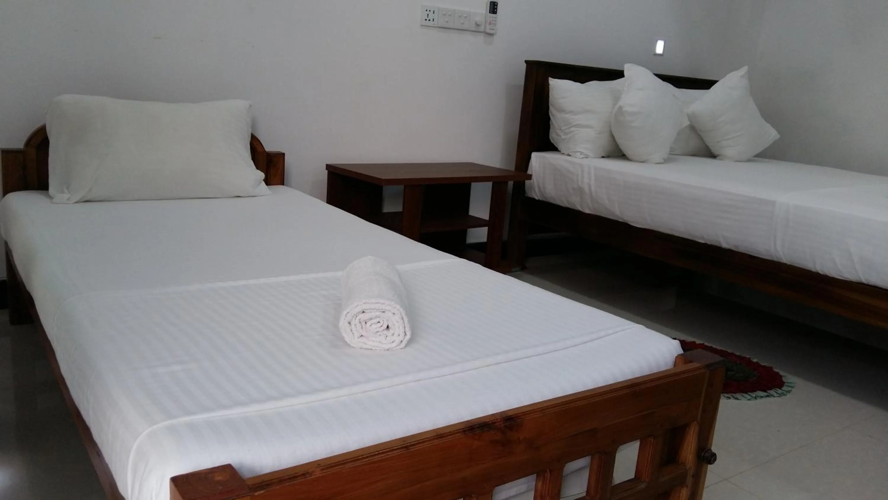 Bed in Butterfly Homestead Hotel