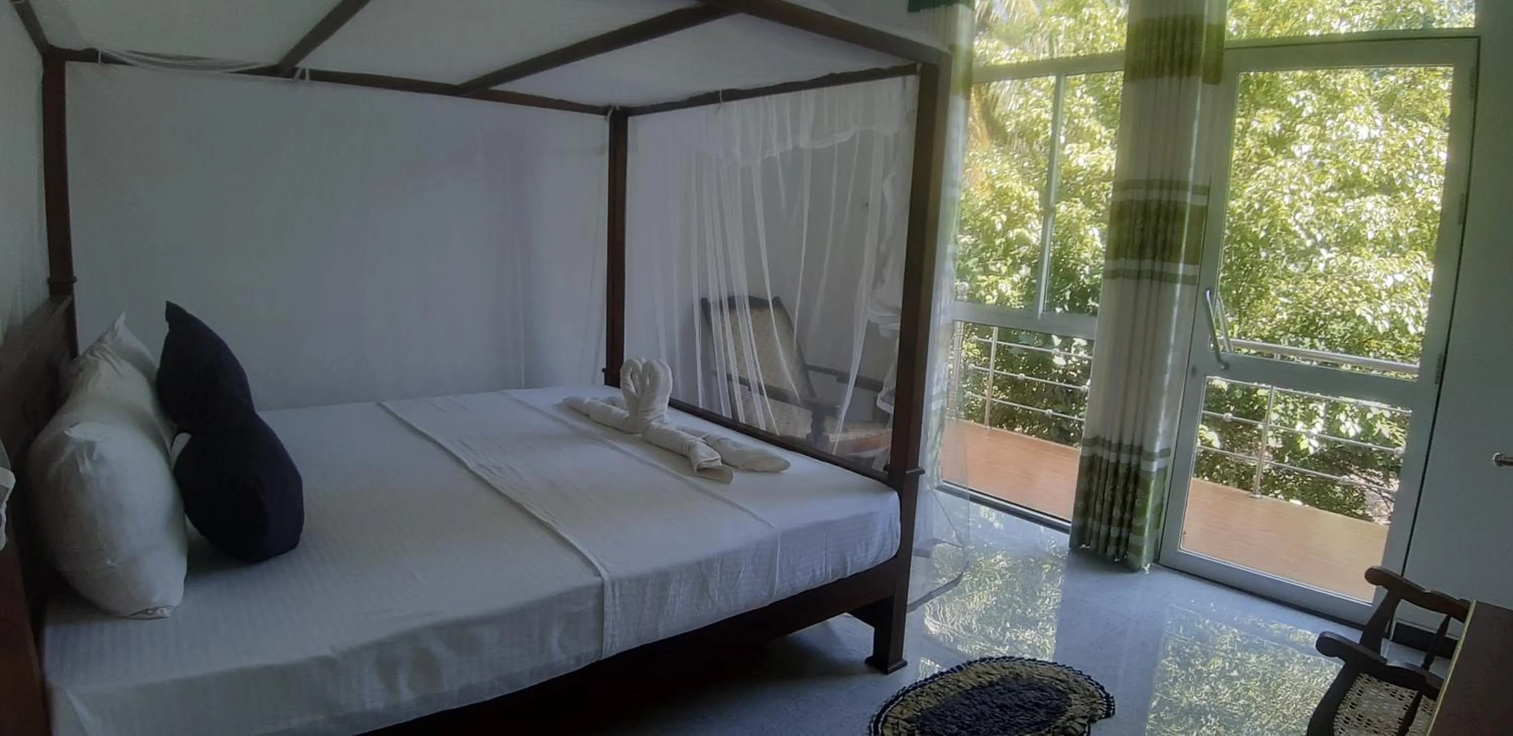 Bed in Butterfly Homestead Hotel