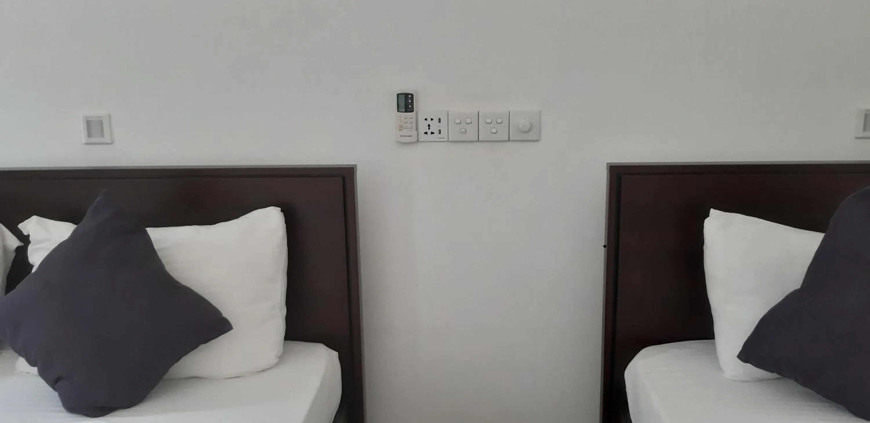 Bed in Butterfly Homestead Hotel