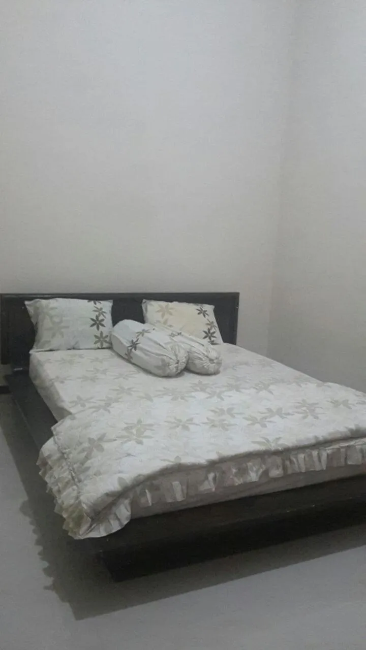 Bed in Homestay Syariah Grahadi