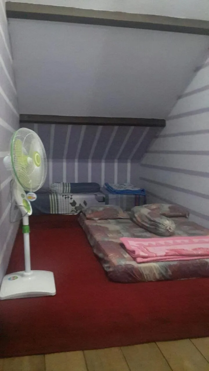 Bed in Homestay Syariah Grahadi