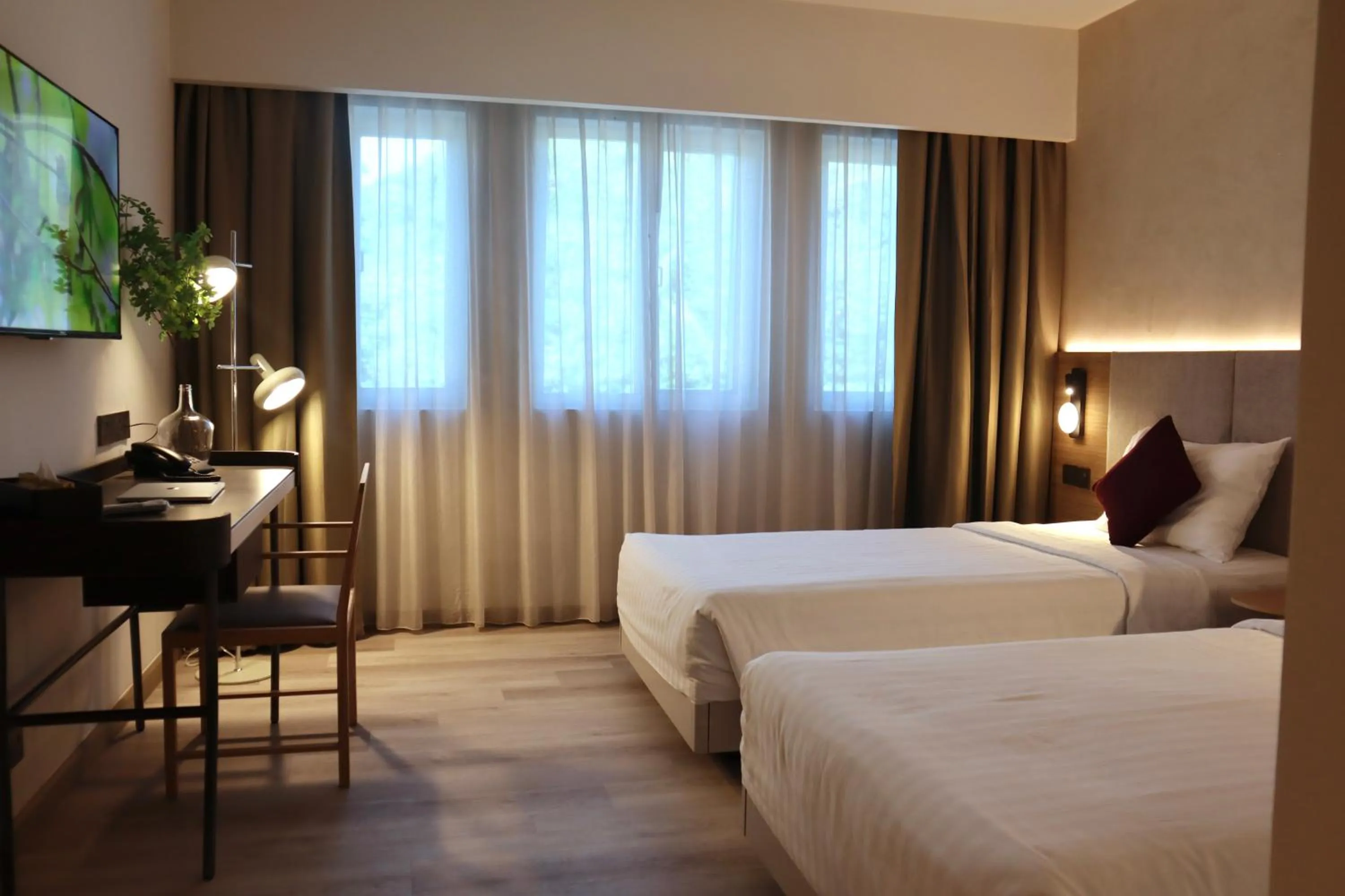 Bed in The Brunei Hotel