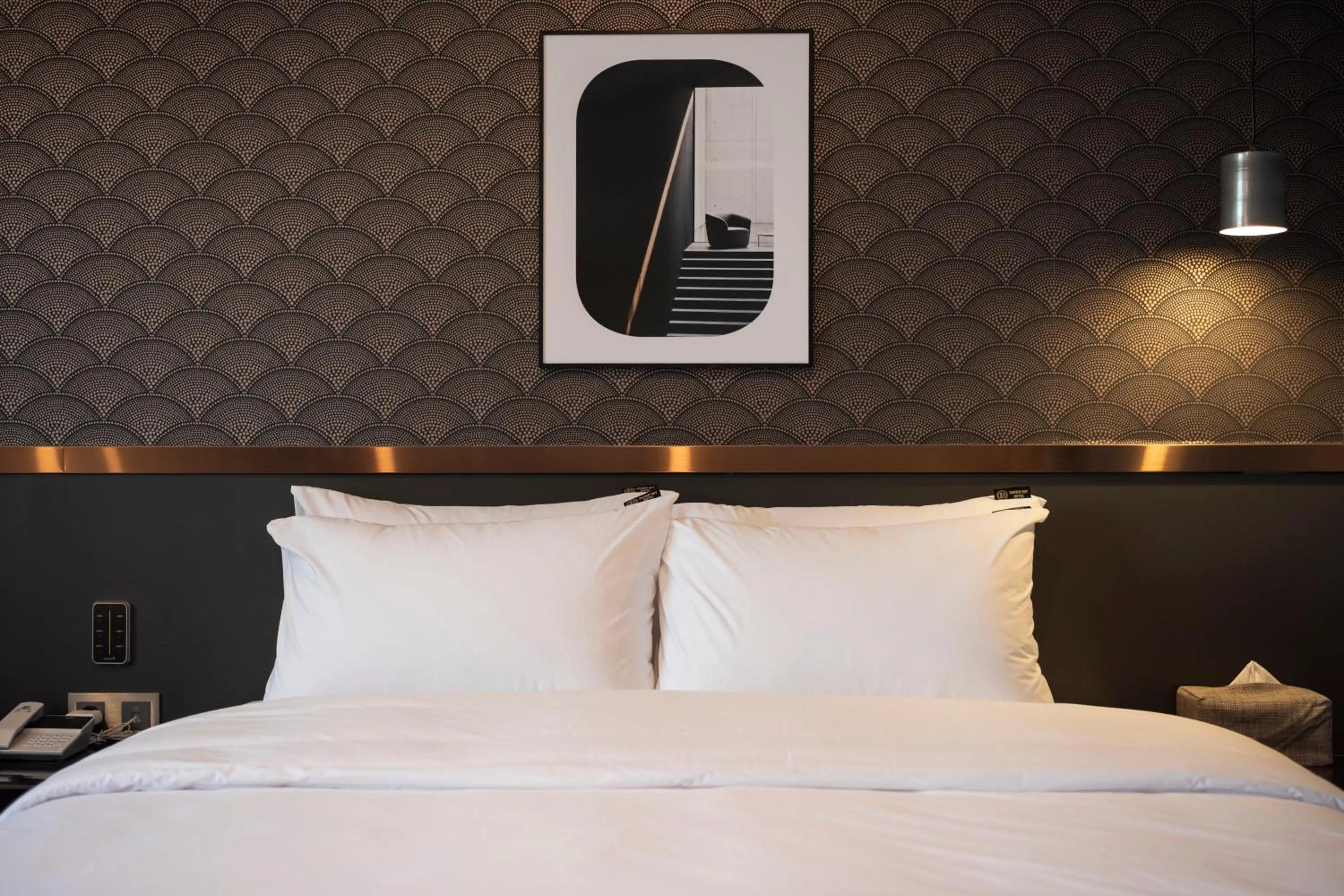 Bed in Brown-Dot Hotel Gupo