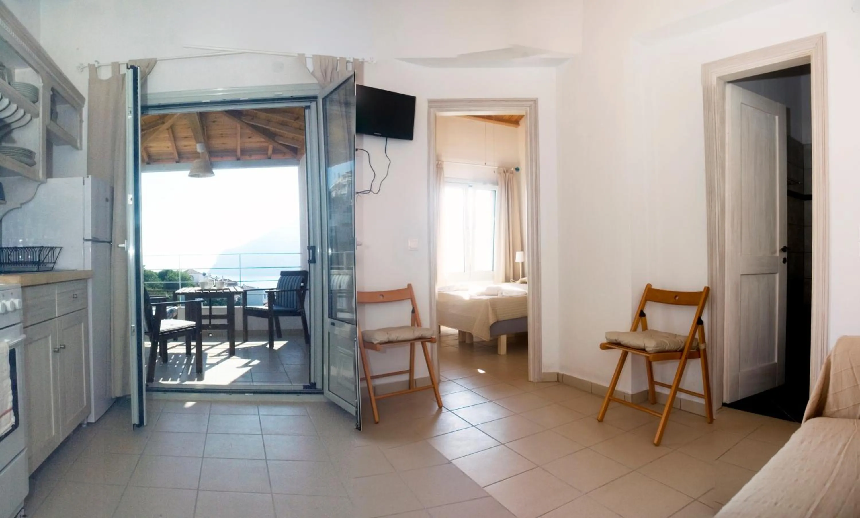TV and multimedia in Thea Home Hotel by Booking Kottas