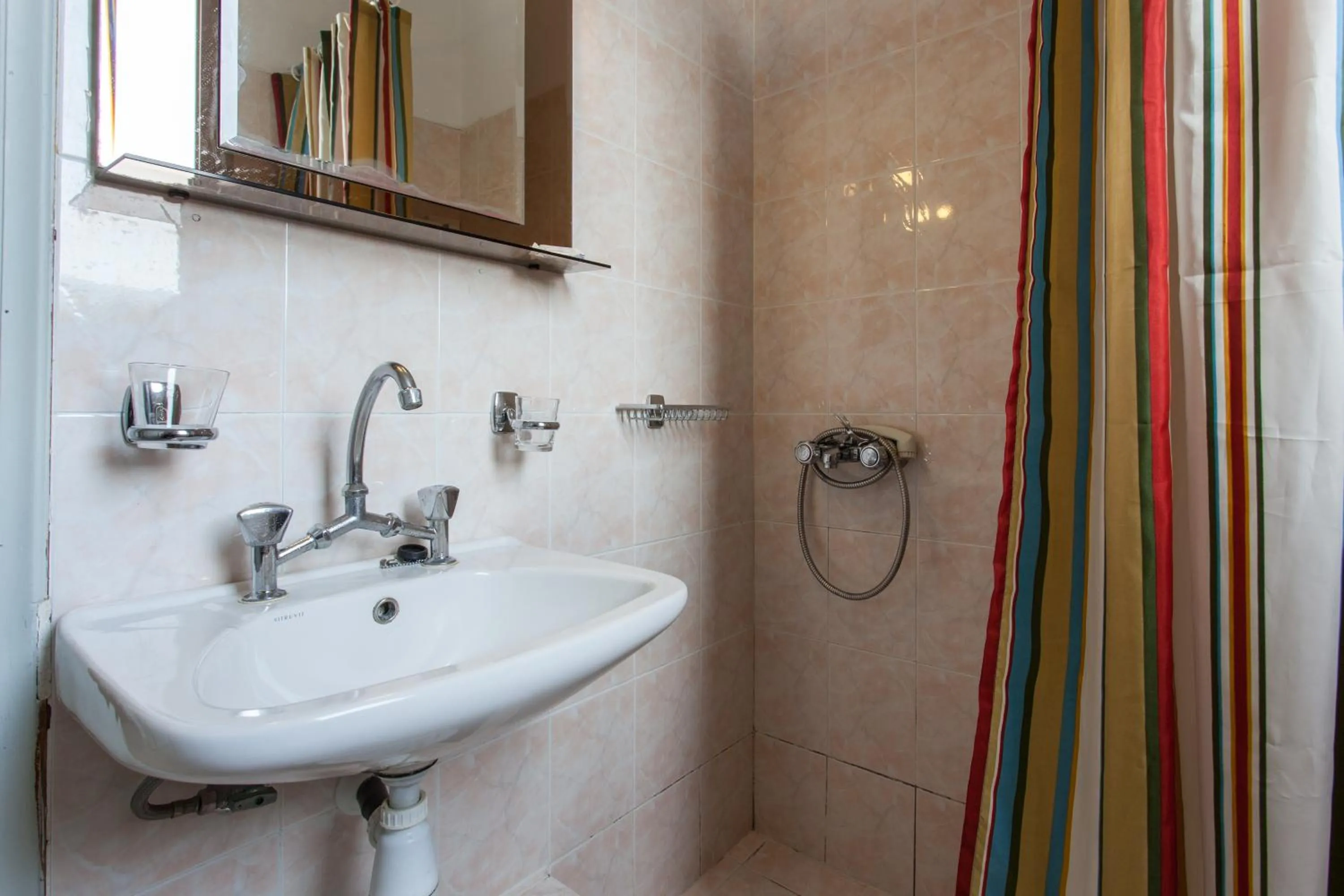 Toilet in Thea Home Hotel by Booking Kottas