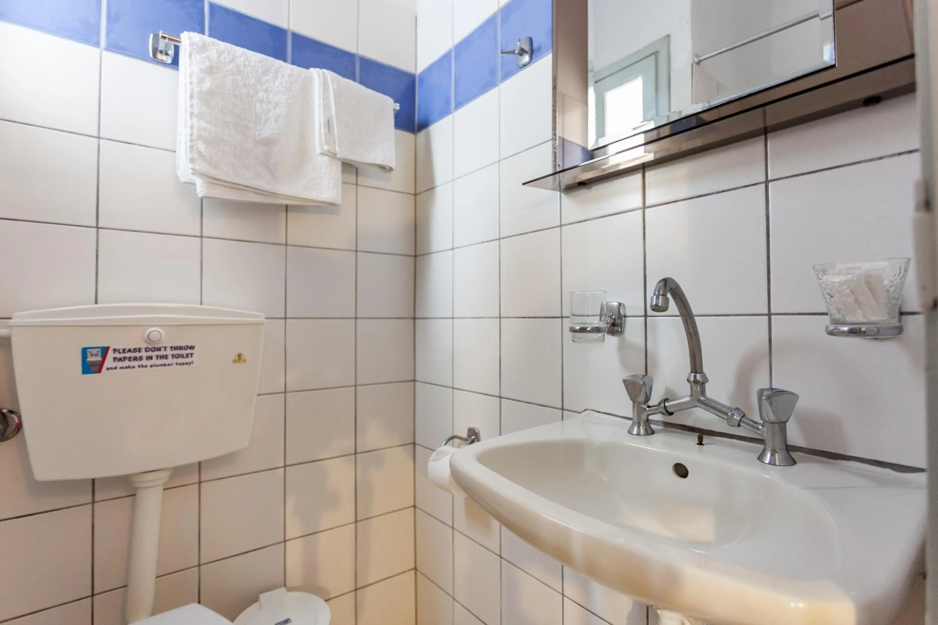 Toilet in Thea Home Hotel by Booking Kottas