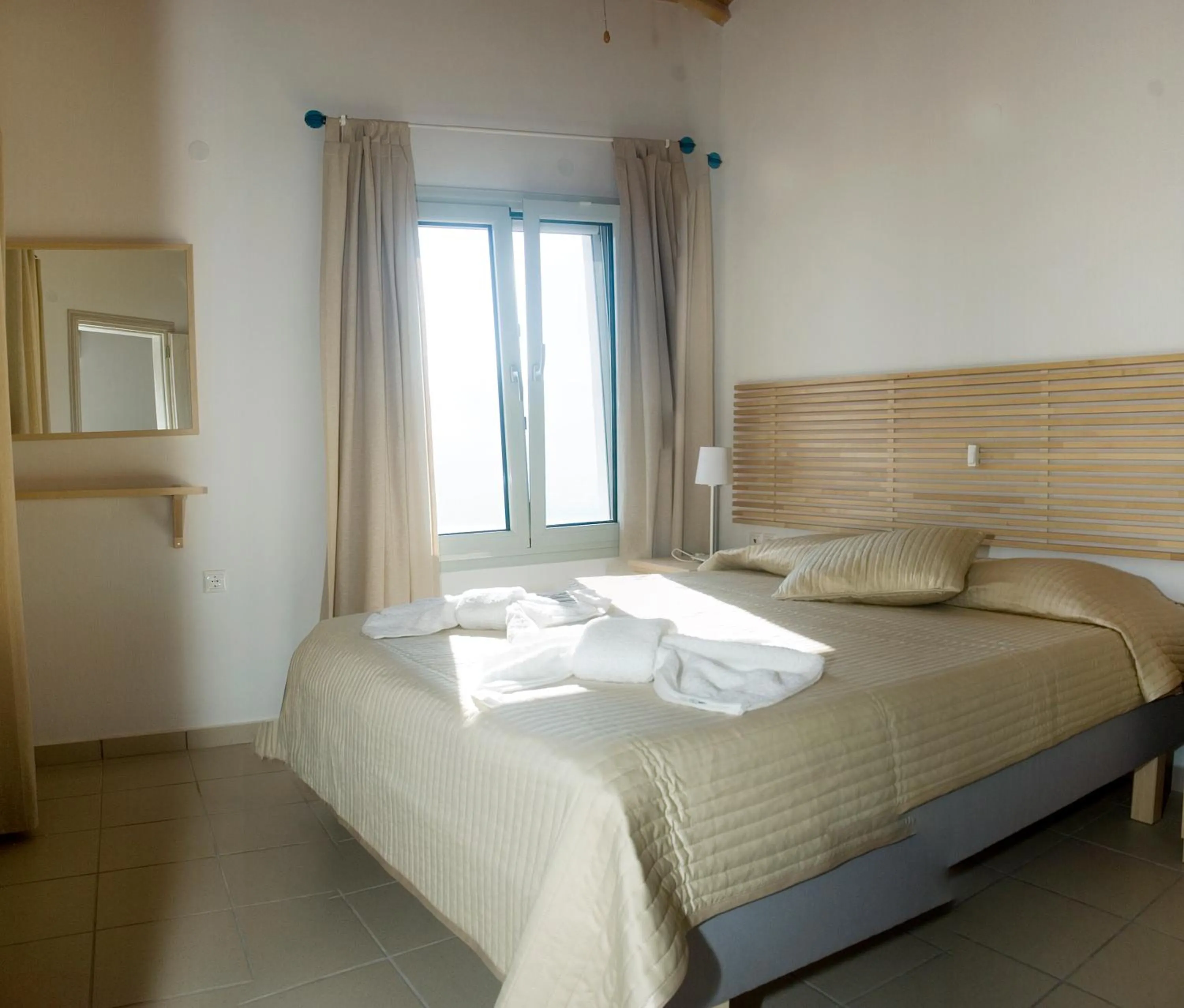 Bed in Thea Home Hotel by Booking Kottas