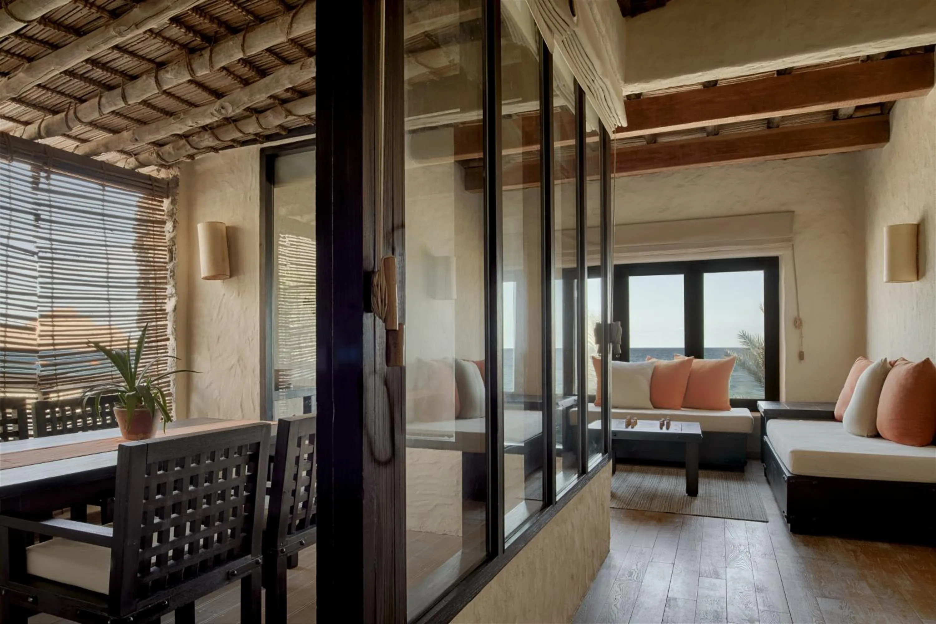 Seating area, Bed in Six Senses Zighy Bay